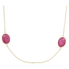Collar de oro amarillo de 14 quilates con rubí ovalado de 23,63 quilates engastado en bisel por metros