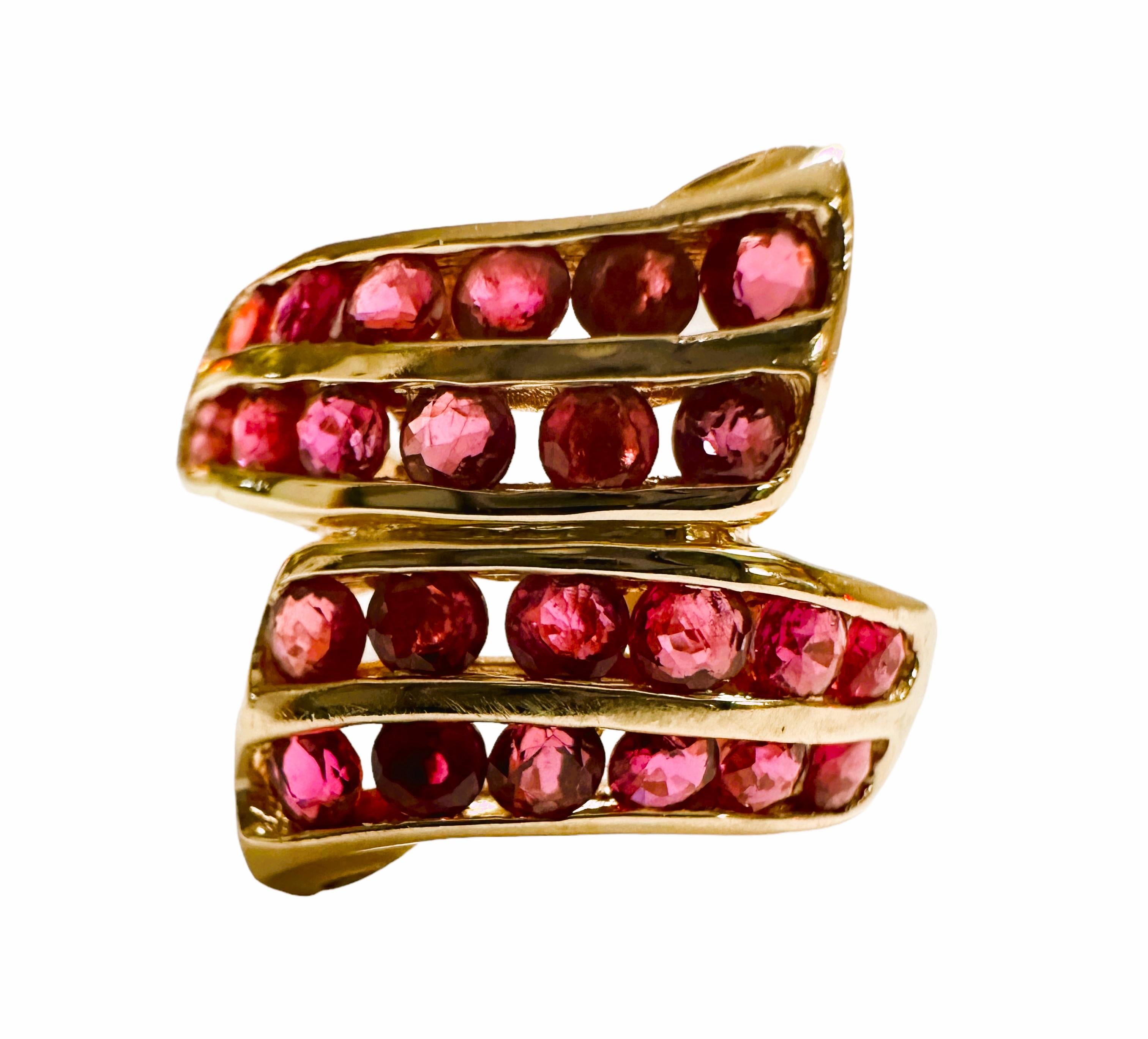 It's a really beautiful ring.  There are 24 round cut rubies measuring 1.8 mm.  This would be approximated .6 carats of rubies.  They look so cool on.  It is are pre-owned and in good condition with some surface scratches.  These can easily be