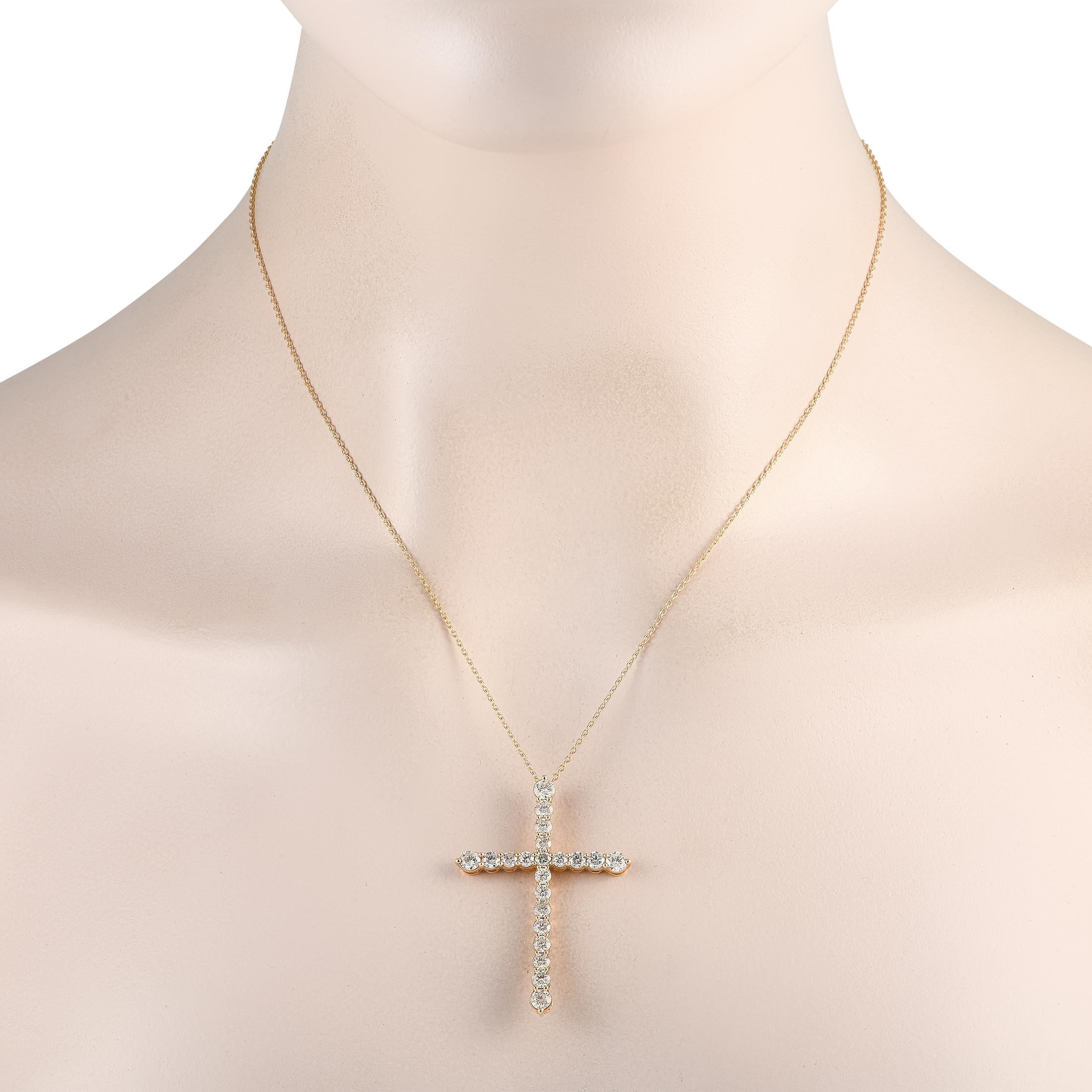 This necklace is poised to serve as a stunning symbol of your faith. Suspended from an 18 chain is a 14K Yellow Gold cross pendant measuring 1.75 long by 1.25 wide. Diamonds with a total weight of 2.50 carats allow it to effortlessly catch the light