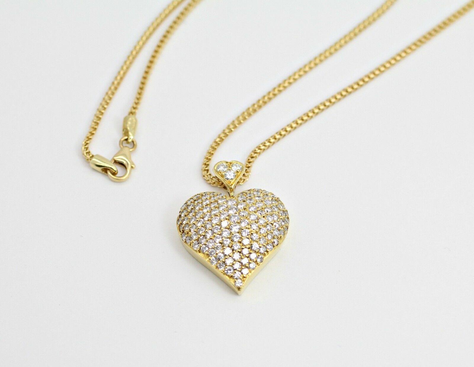 Diamond Specifications
Main Stone:Diamonds
Shape:   Round
Carat Total Weight:  2.50ctw 
Color:    D  
Clarity:   VS2 - SI1
Jewelry Specifications
Brand:
Metal: 14k yellow gold
Type: Heart Necklace
BuyWeight:   16.11 grams
Size:  18 inch chain       