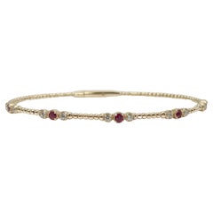 14K Yellow Gold .25CTW Diamond and .29CTW Ruby Bangle