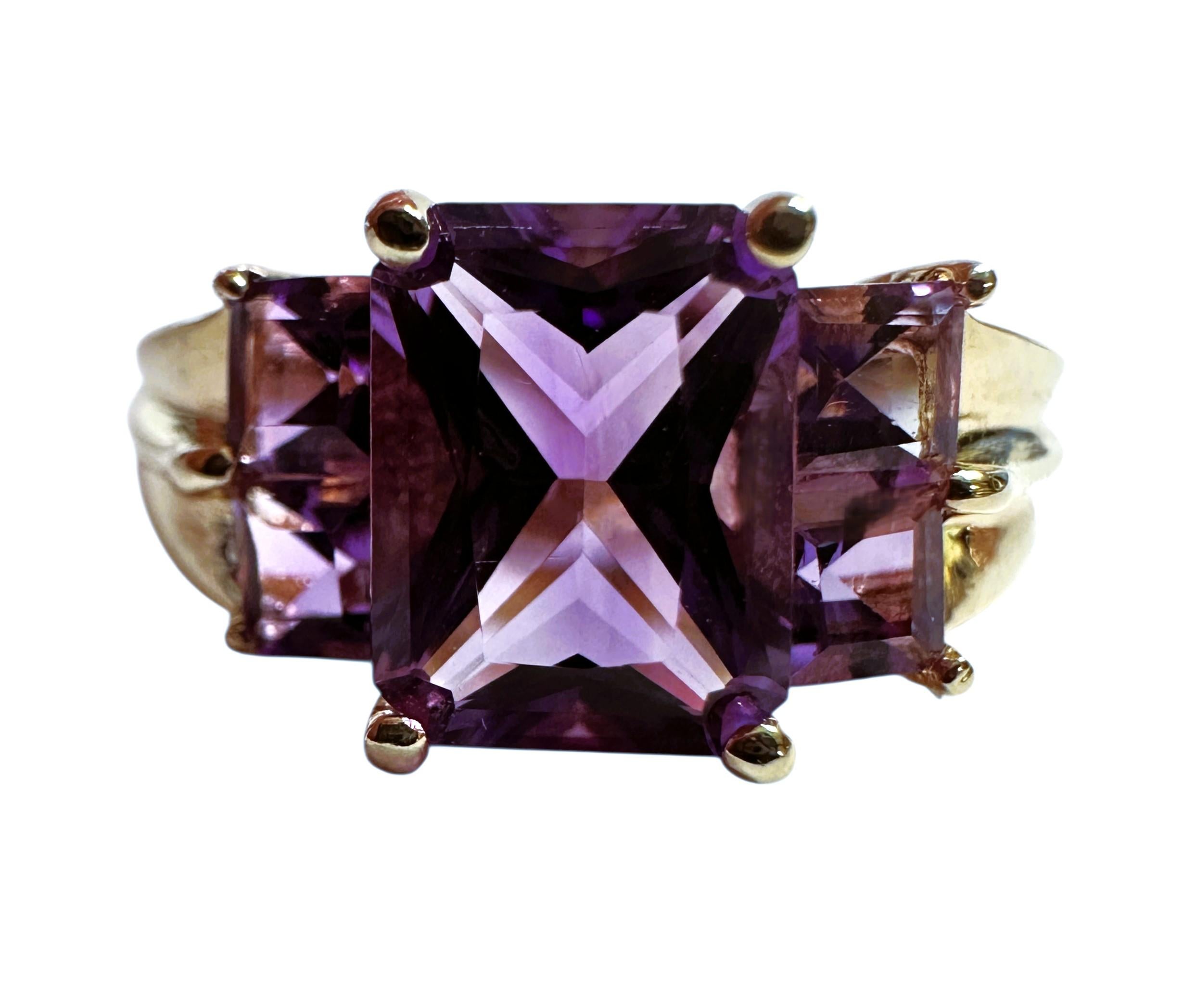 I just love radiant cut stones.  They are just so beautiful.  The radiant cut stone in this ring is 8 x 6.2 mm totaling 2 carats.  It is flanked by 2 square cut amethyst on either side and they are 3 x 3 mm totaling .72 carats.  The ring is a size 7