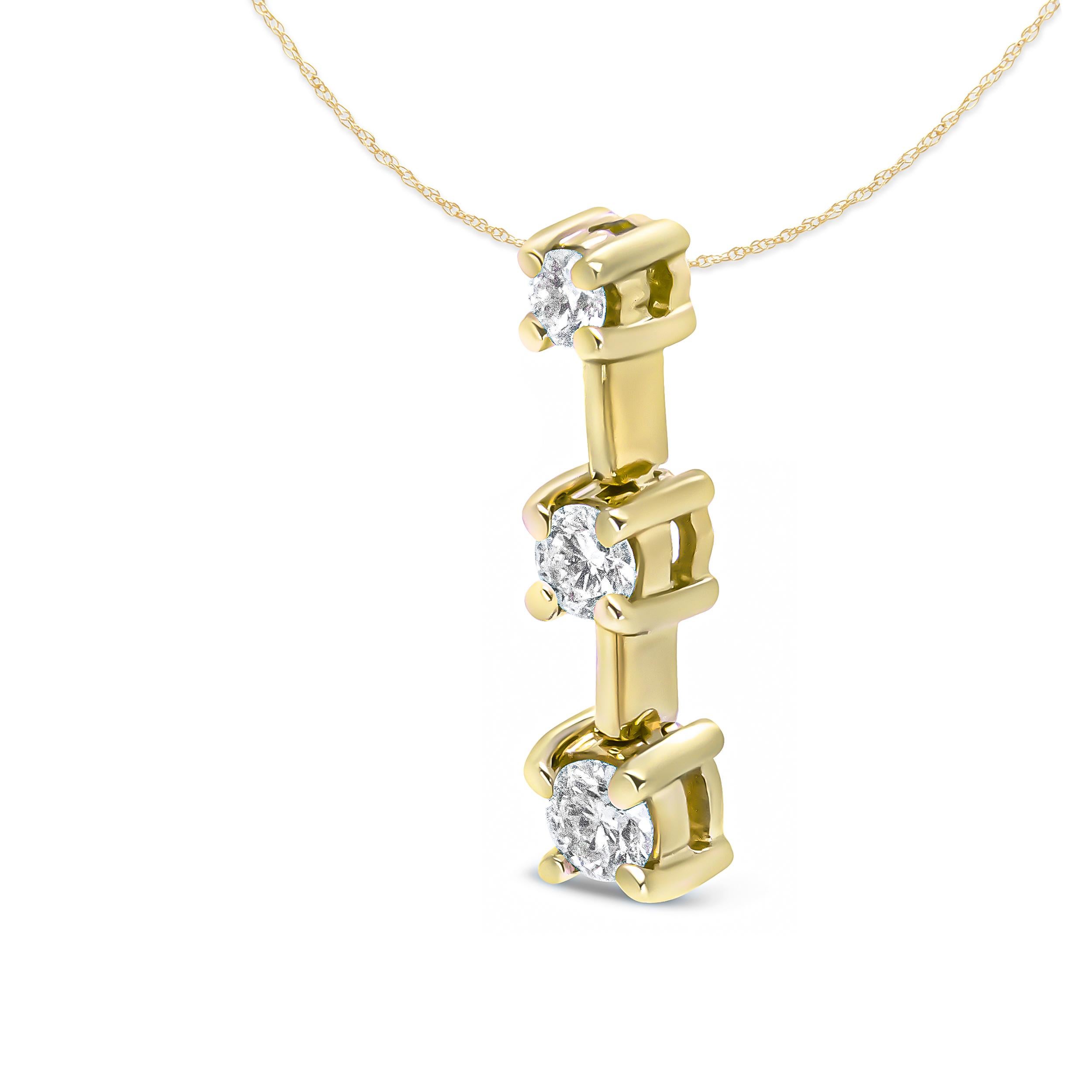 This three stone drop journey pendant necklace is a symbolic piece representing your past, present, and future. Three round diamonds in prong settings cascade downward in gradual sizes, with the diamonds totaling 3/4 cttw and an approximate H-I