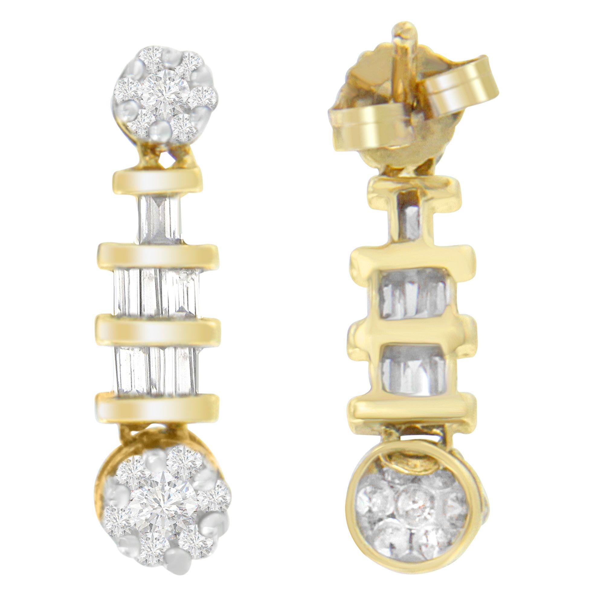 Emanate an aura of classic elegance with these exquisite dangle earrings, masterfully crafted from polished 14K yellow gold. A beguiling mixture of round and baguette-cut diamonds, totaling 3/4 carats, cascades delicately from your ears, catching