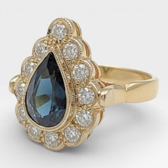 14K Yellow Gold 3 Ct. Bluish Green Sapphire with 12 Round Diamonds. (Size 5.0)