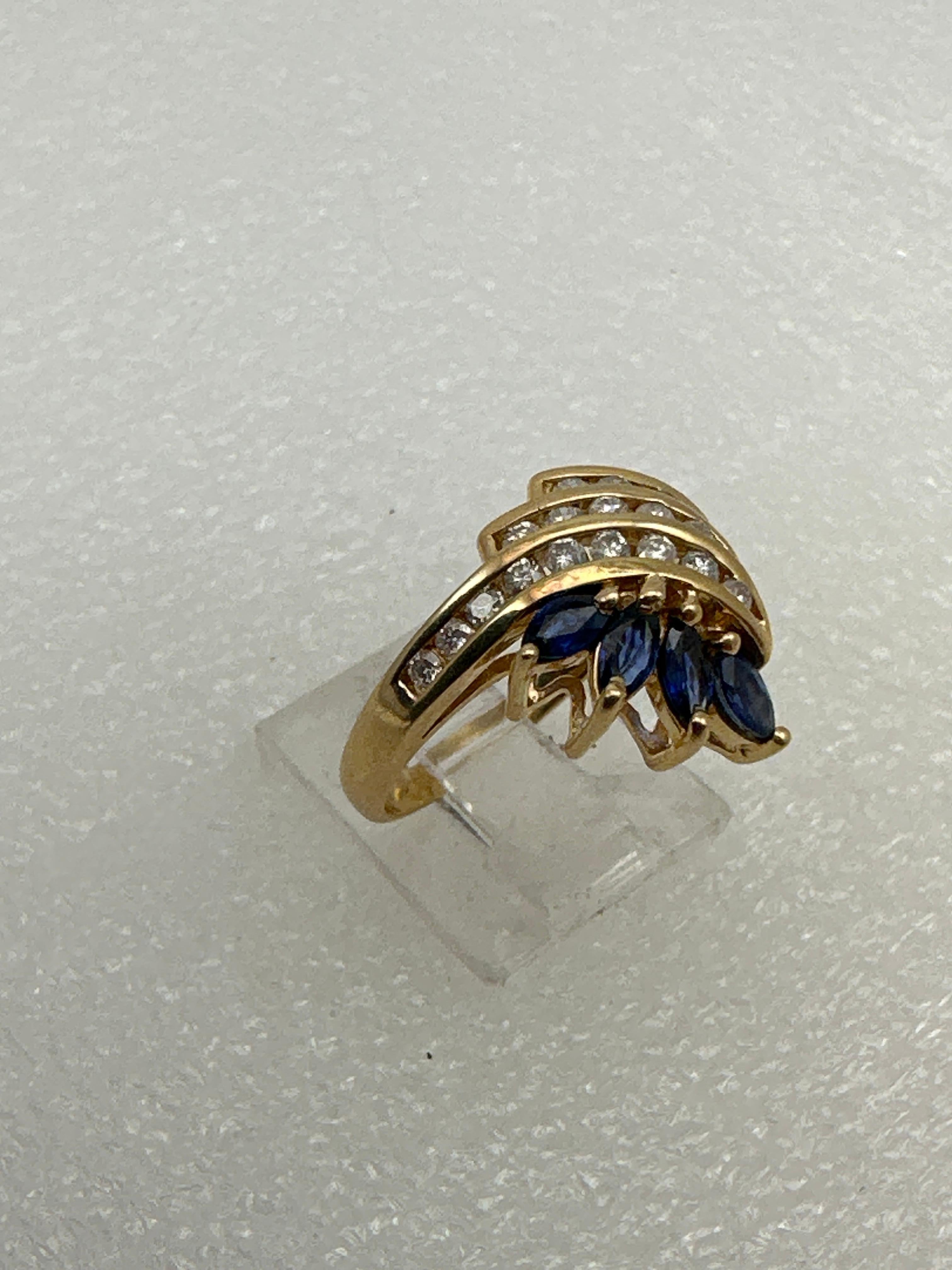 14k Yellow Gold ~ Marquise Sapphires Round Diamonds Cocktail Ring ~ Sz 6 3/4
Sapphire measure approx 2.5mm x 4.5mm
20 round diamonds 

Sapphire is the birthstone for the month of September and is mostly known as the wisdom stone. It is meant to