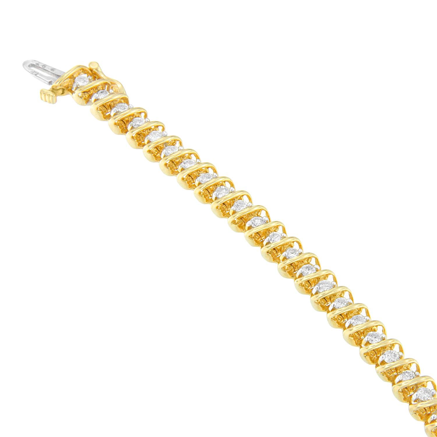 Bold meets brilliant! This unique bracelet is crafted with classic round cut diamonds nestled between raised bands of high shine yellow gold to form a dazzling spiral effect for the woman who loves to stand out from the crowd. Bracelet has 42