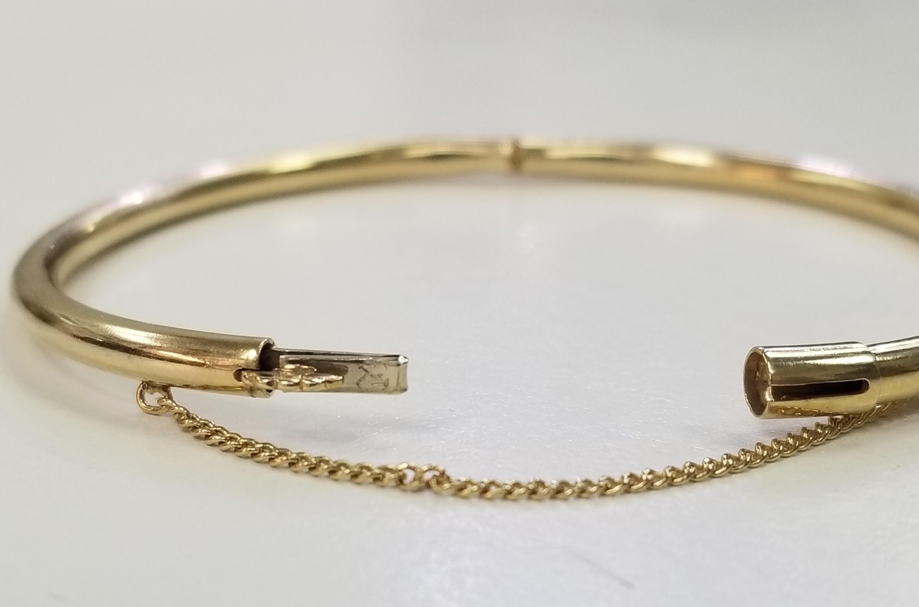 14k Yellow Gold  3.5mm Hollow Bangle Bracelet  with Safety Chain
Specifications:
    metal:  14K gold
    type: BRACELET
    width: 3.5mm
    weight: 8.10 gr
