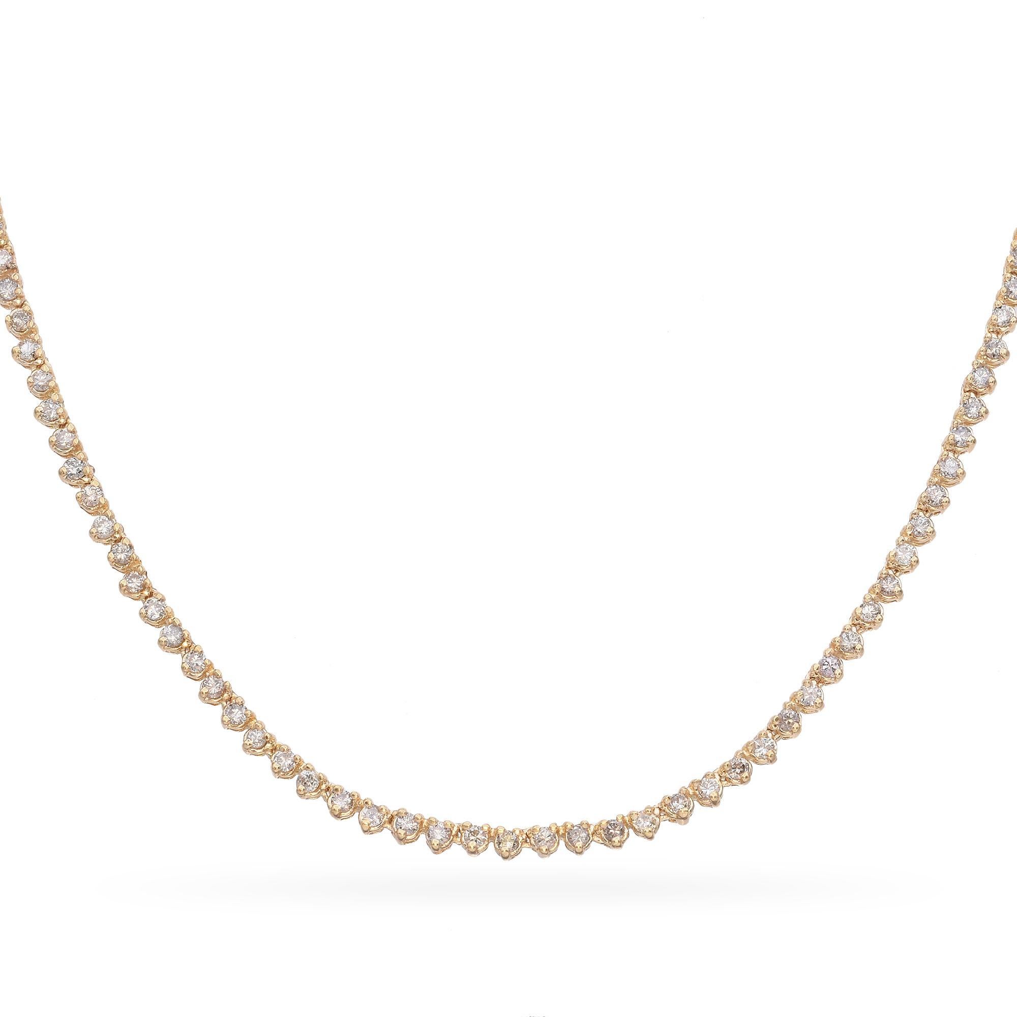 Featuring a continuous line of sparkling diamonds, each stone is meticulously set to create a seamless flow of brilliance. Crafted in luxurious gold, the necklace exudes sophistication and timeless beauty.

Weight: 13.8 grams 
Stone: 3.62tcw Round