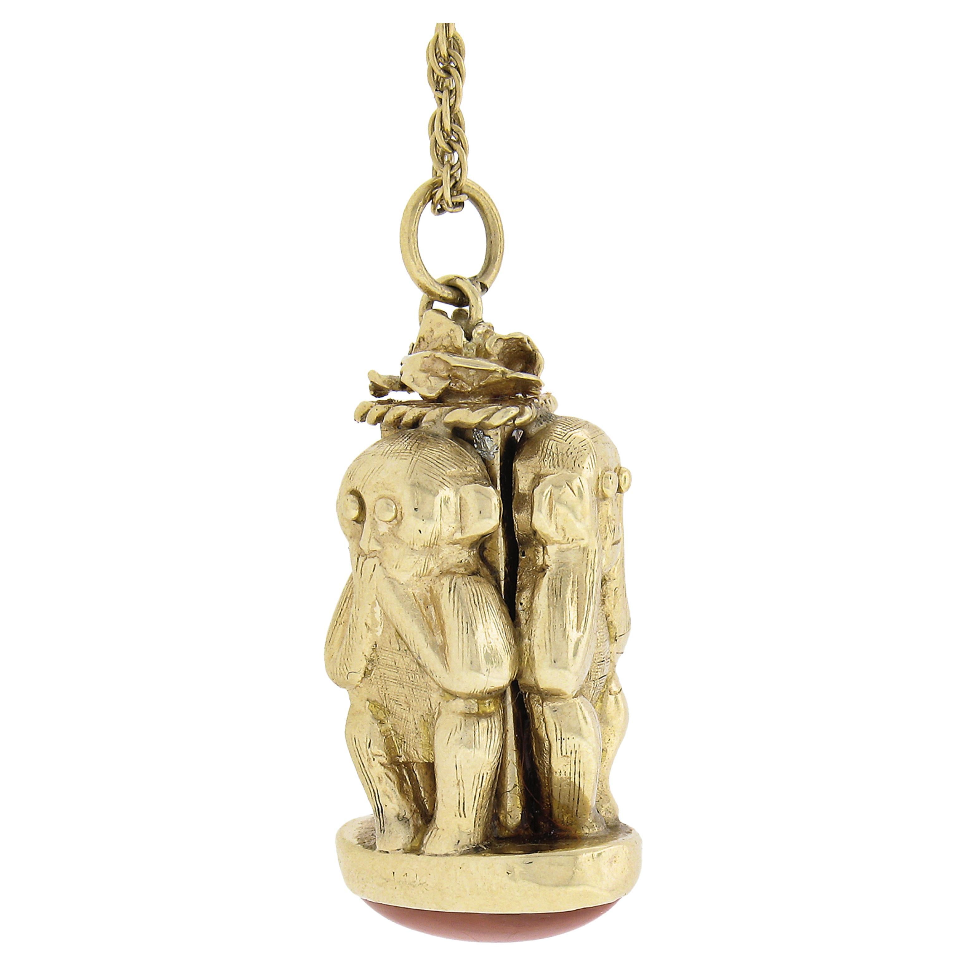 Here we have a beautiful perfume flask charm/pendant that is crafted in solid 14k yellow gold and features a 3D see. speak, hear no evil monkey design. The bottom of the pendant is adorned with oval cabochon cut natural coral with a beautiful rich