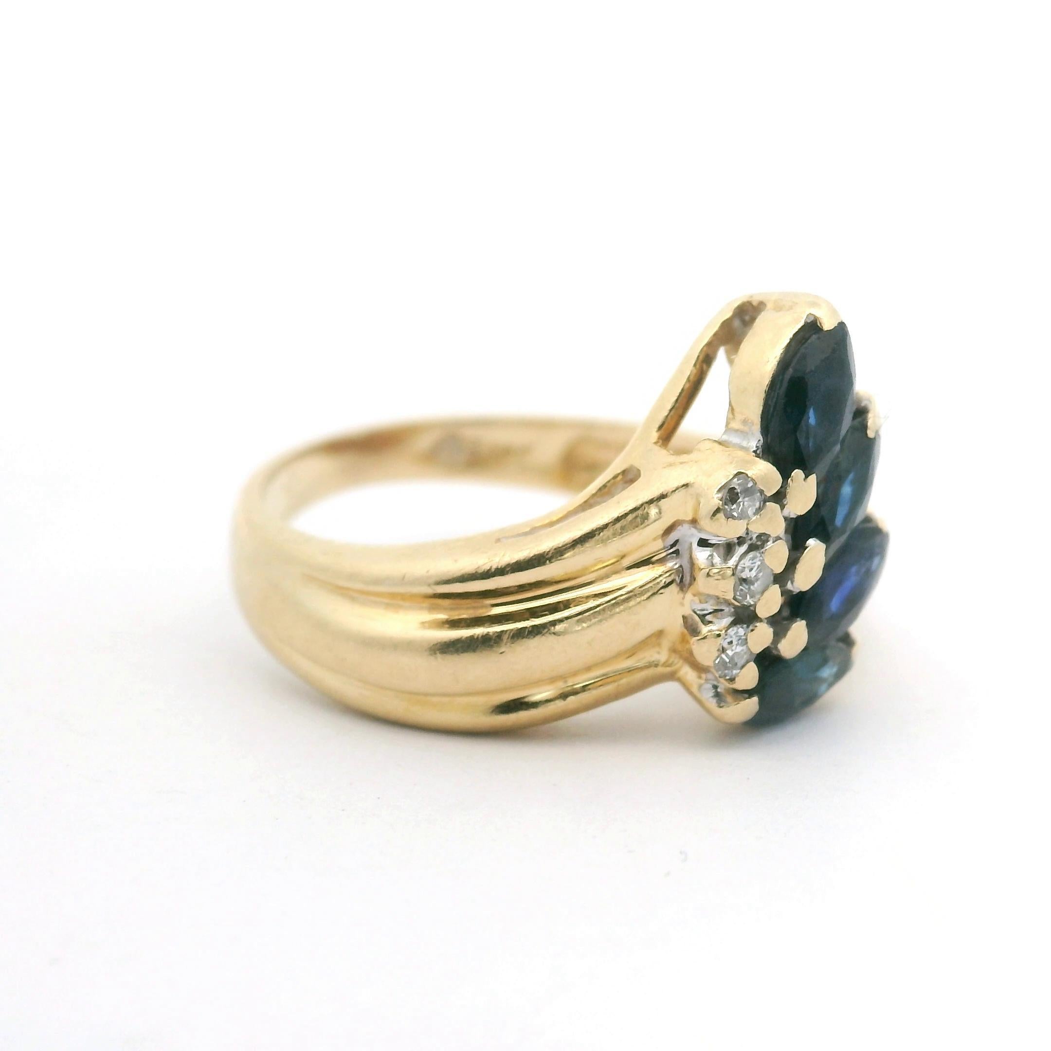 Condition:  Excellent Condition, Professionally Cleaned and Polished
Metal:  14k Gold (Marked, and Professionally Tested)
Weight:  3g
Gemstone:  Four Marquise Cut Blue Sappires
Diamonds:  Three Round Cut Natural Diamonds
Band Width:  2mm
Size: 