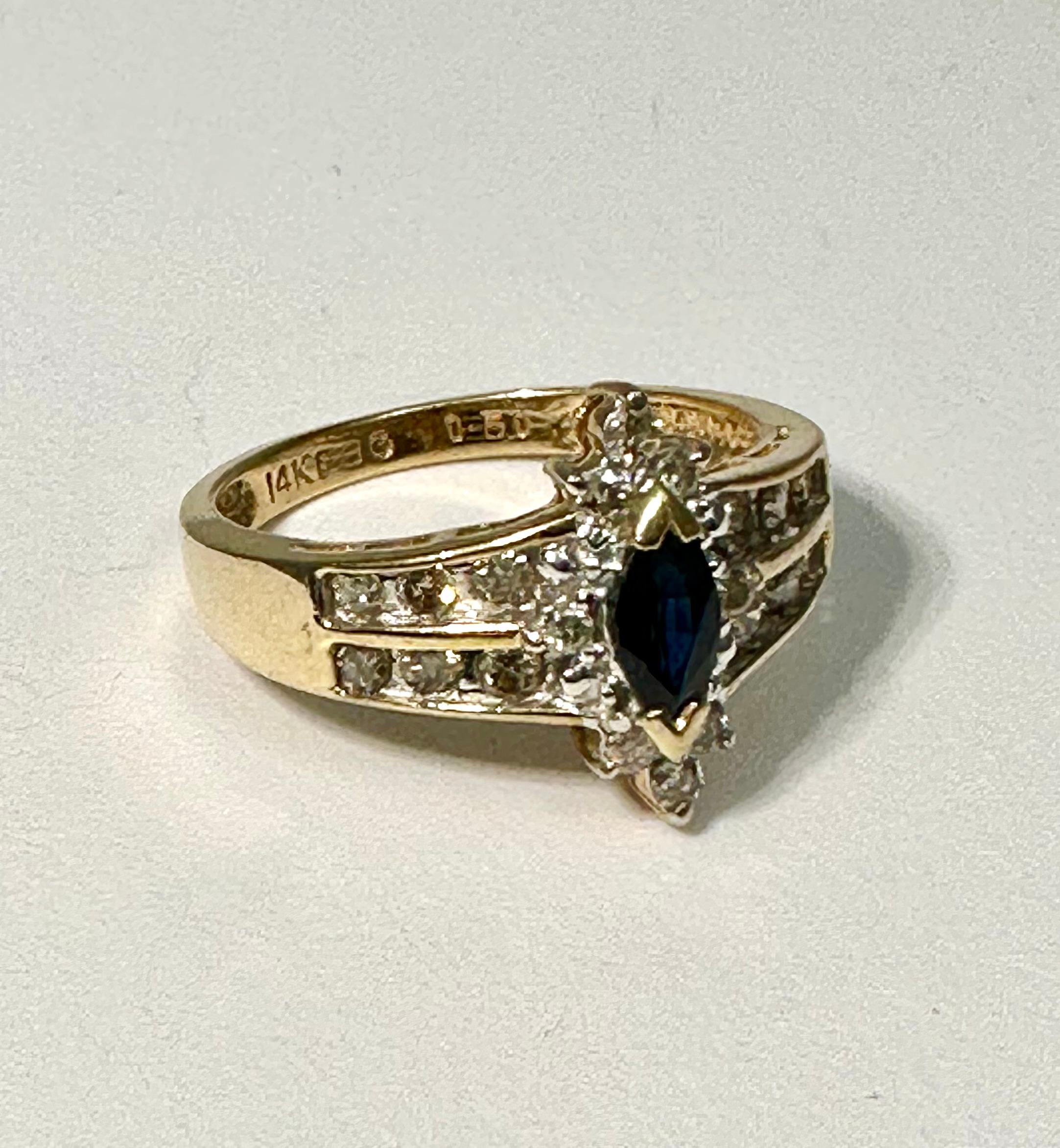 14k Yellow Gold ~ 3mm x 5mm Marquise Sapphire with 20 Diamonds Ring ~ Sz 7 1/2

Meaning: Sapphire is a stone of wisdom and royalty, often associated with sacred things and considered the gem of gems, guiding individuals to an enlightened