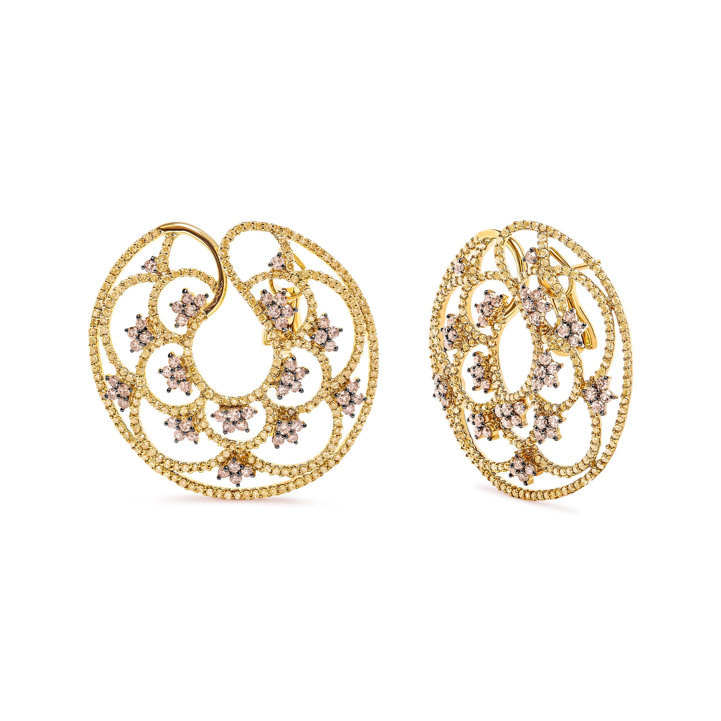 Introducing a celestial masterpiece crafted in 14K yellow gold, these breathtaking hoop earrings will transport you to a world of heavenly elegance. With a total diamond weight of 4 7/8 cttw, these stunning earrings boast 641 round diamonds,