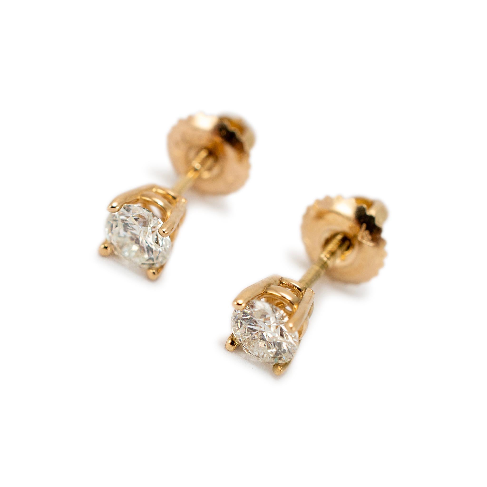 Gender: Ladies

Metal Type: 14K Yellow Gold

Diameter: 4.25 mm

Weight: 1.03 gram

One pair of 14K yellow gold diamond stud earrings with screw backs. The metal was tested and determined to be 14K yellow gold. Engraved with 