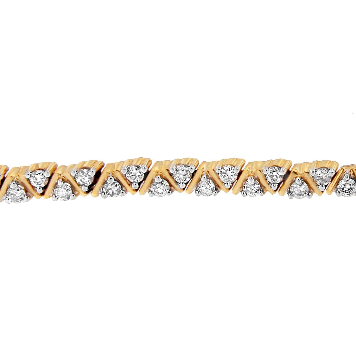 When brilliance and illumination take over, her wrist radiates a shine unlike any other. In the middle the fascination of glistening round cut diamonds is breathtaking. This tennis bracelet featuring triangular pattern with encrusting of 14 karats