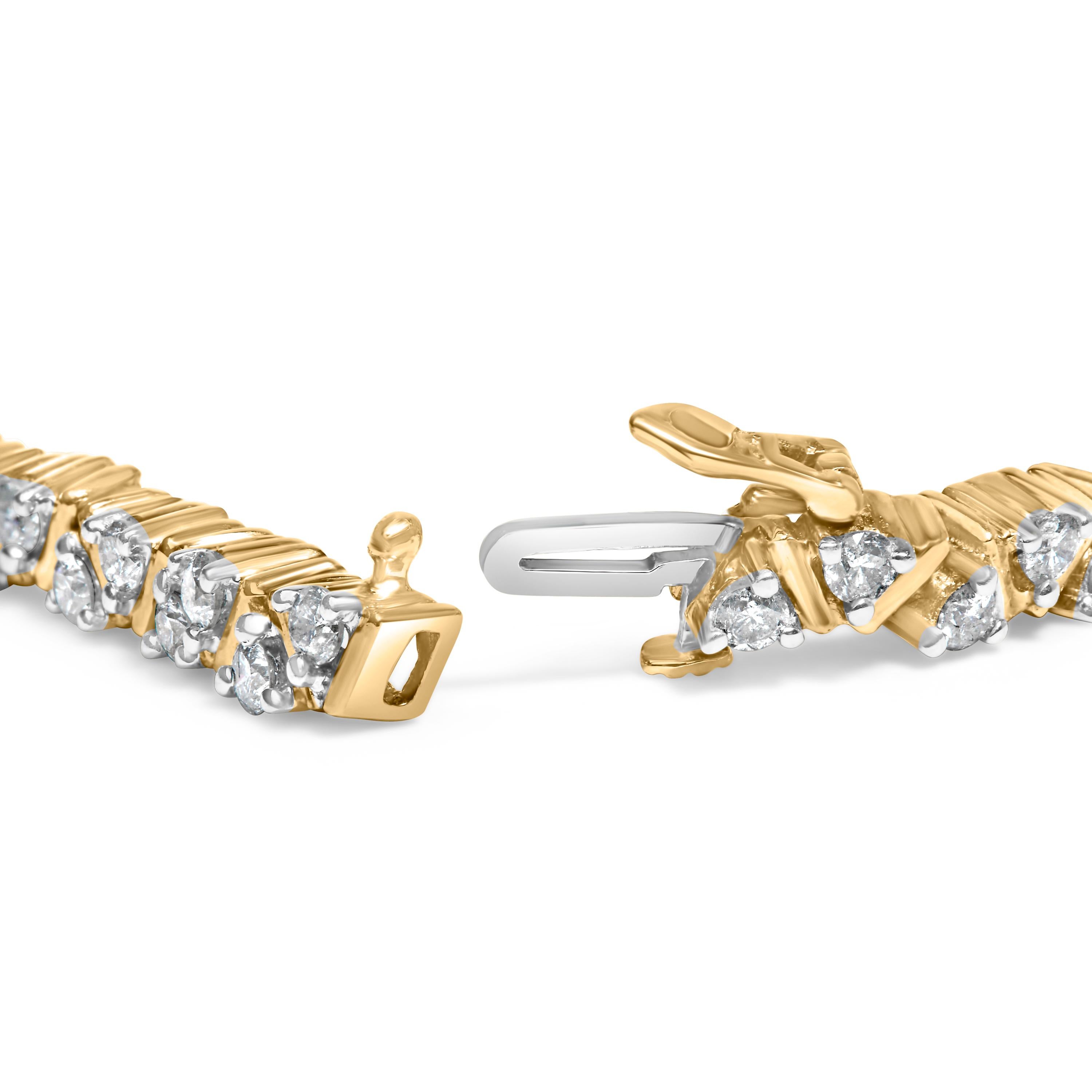 Imbued with a radiant harmony of luxury and geometric sophistication, this exquisite tennis bracelet features a stunning sequence of triangle-shaped links, each exquisitely cradled in 14K yellow gold. Encompassing 4.00 carats of natural diamonds