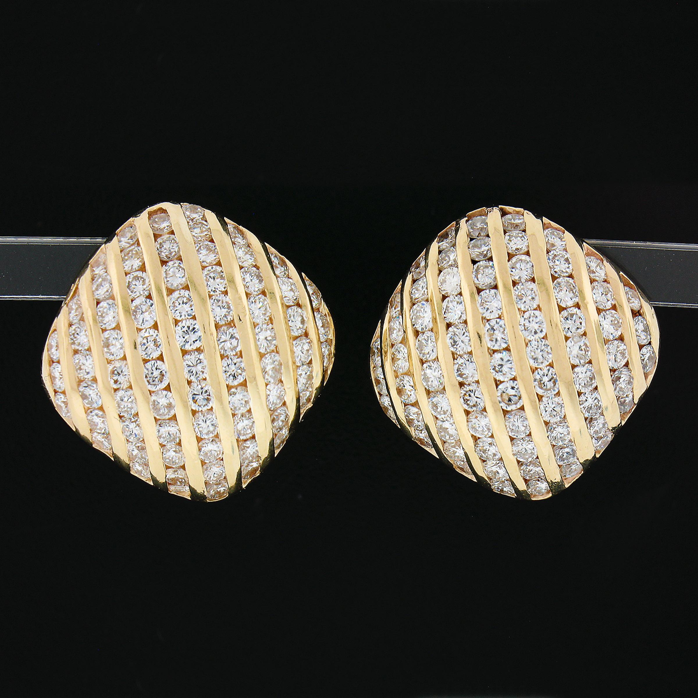 You are looking at a magnificent and very well made made pair of earrings that is crafted in solid 14k yellow gold. They feature a cushion shape button style that is completely drenched in very fine quality diamonds throughout. These round brilliant