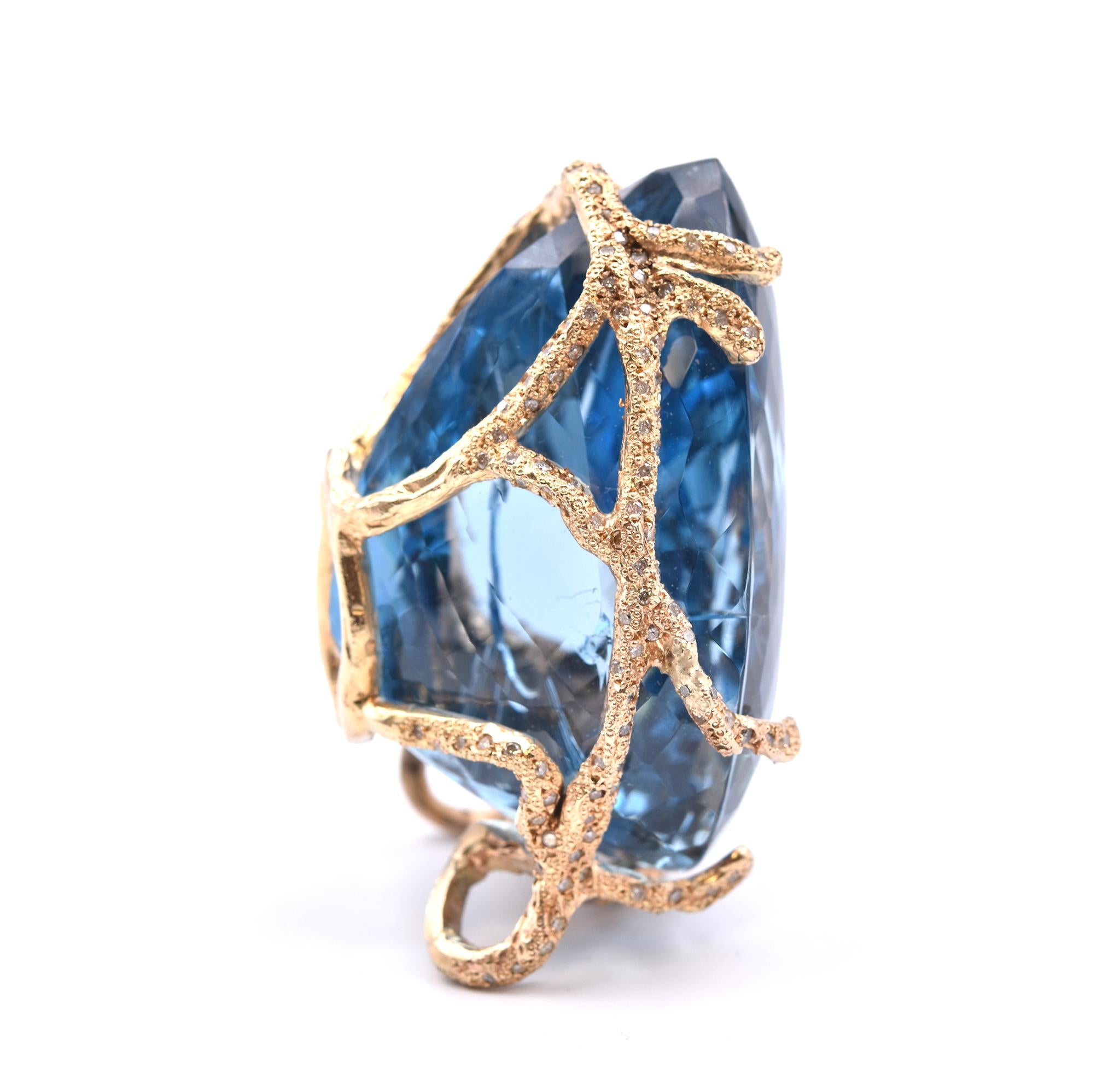 Material: 14k yellow gold
Gemstone: pear cut blue topaz = 426 carats
Diamonds: 225 round brilliant cuts = 3.40cttw
Color: H-J
Clarity: SI
Dimensions: Pendant measures 64.25mm x 50mm
Weight: 162.75 grams
