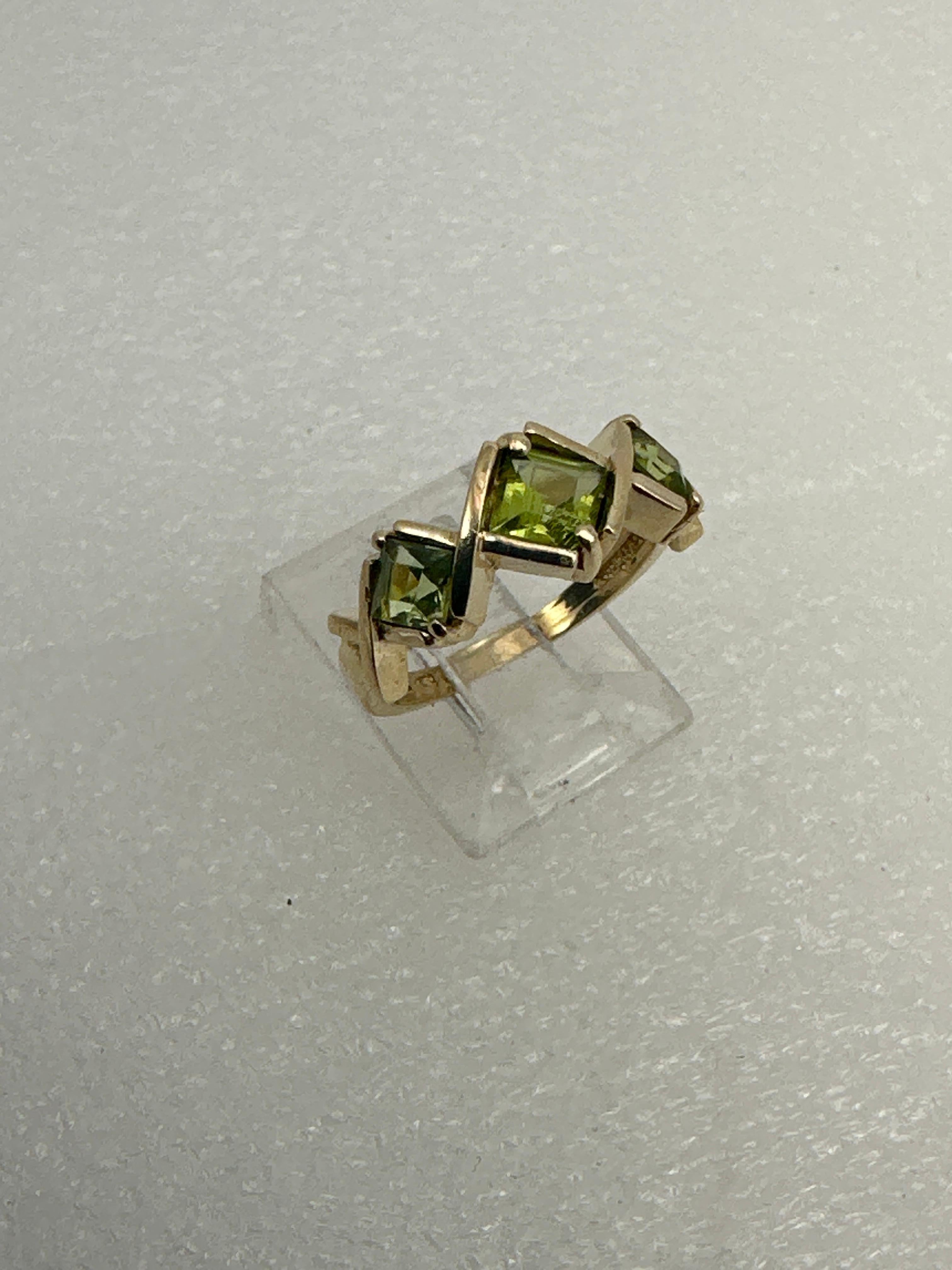 14k Yellow Gold ~ 4.5mm & 5.5mm Square Peridot Ring ~ Size 7

Center Stone measure approx 5.5mm
2 Side stones measure approx 4.5mm

Peridot, the birthstone for the month of August, is also given in celebration of the 16th year of marriage. Known as