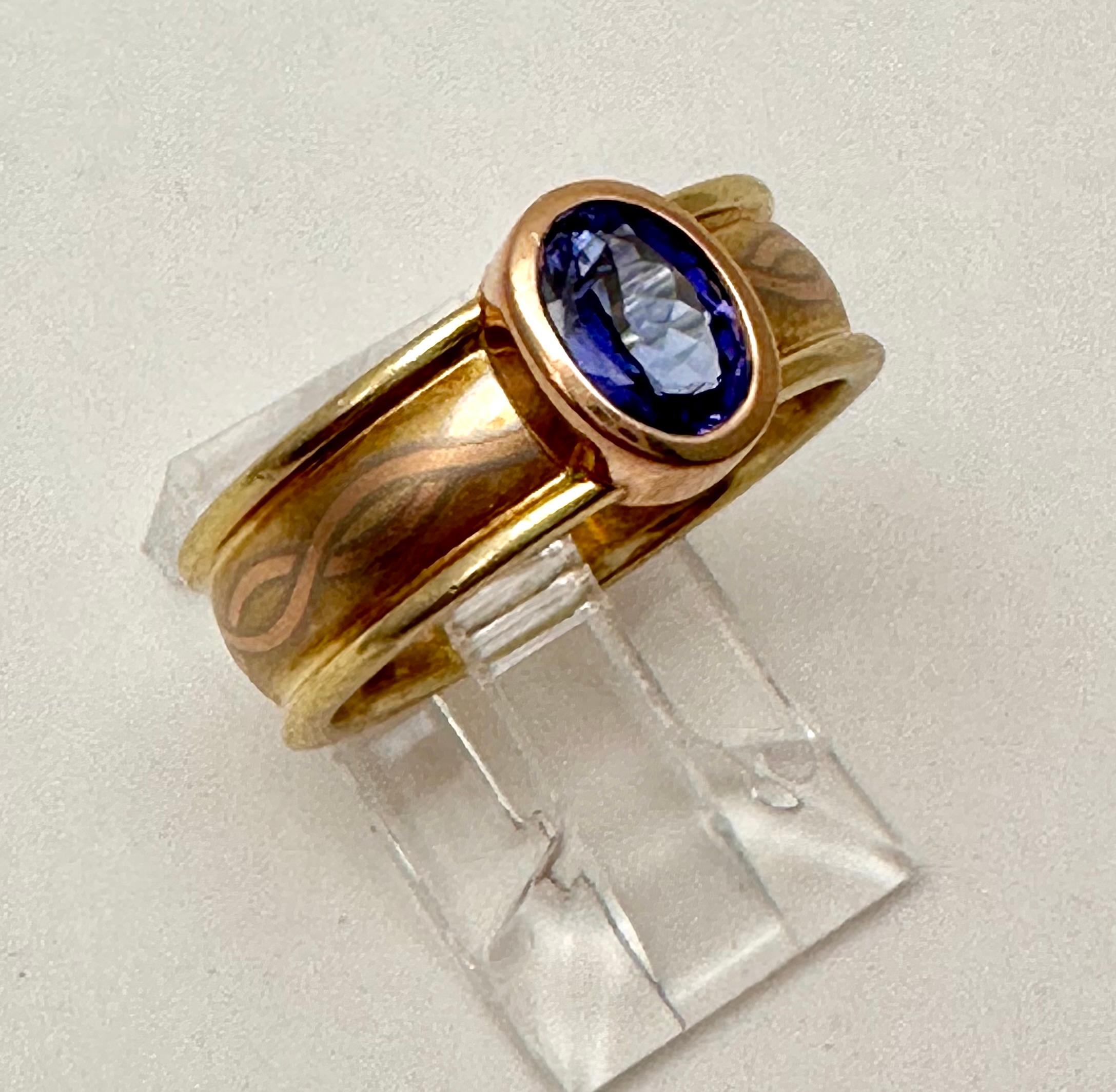 Modern 14k Yellow Gold 4.5mm x 6.5 Oval Cut Tanzanite Ring Size 7 For Sale