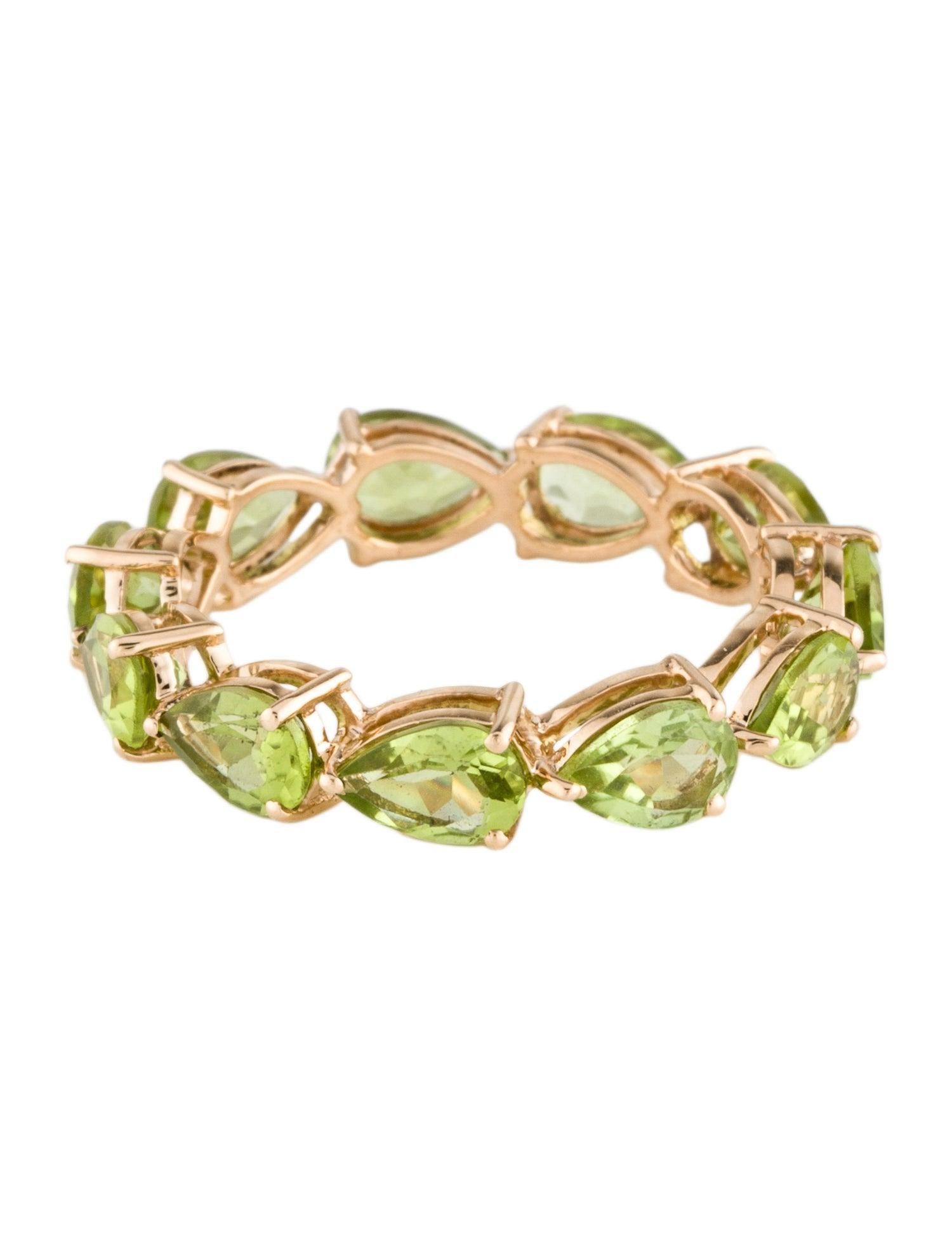 Celebrate the brilliance of fine jewelry with our 14K Yellow Gold Peridot Eternity Band. Perfectly crafted to size 7.75, this exquisite piece showcases 4.70 carats of Pear Modified Brilliant Peridot, set in a continuous circle to symbolize eternal