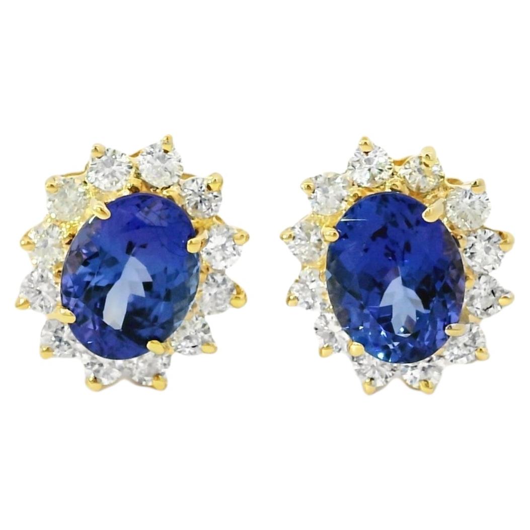 Pendientes de oro amarillo de 14k con tanzanita talla oval de 4,75 ctw y diamante brillante redondo