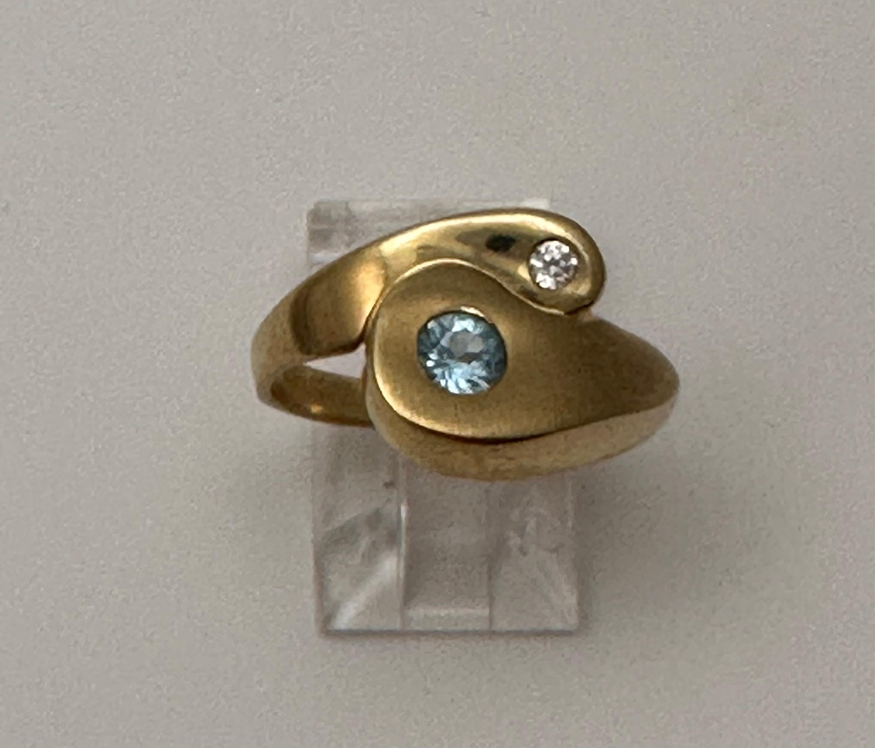 14k Yellow Gold approx. 4mm Round Blue Topaz and 2.2mm Round Diamond 
Ring Size 8

Blue Topaz Meaning
This vivacious blue gemstone is known as the stone of clarity. The Blue Topaz meaning allows you to channel your inner wisdom and find the perfect