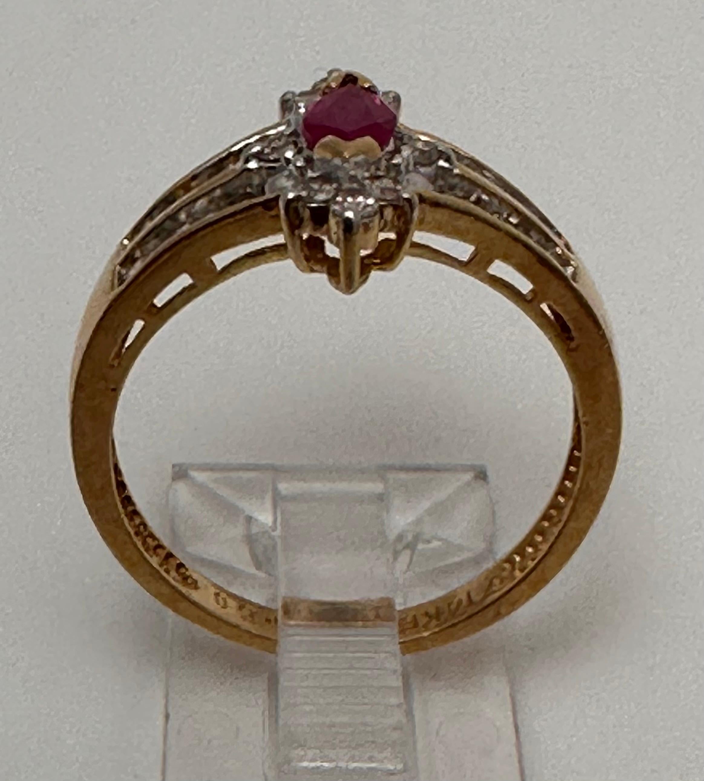 14k Yellow Gold 4mm x 6mm Marquise Ruby .50c Diamond Ring Size 7 1/2 In New Condition For Sale In Las Vegas, NV