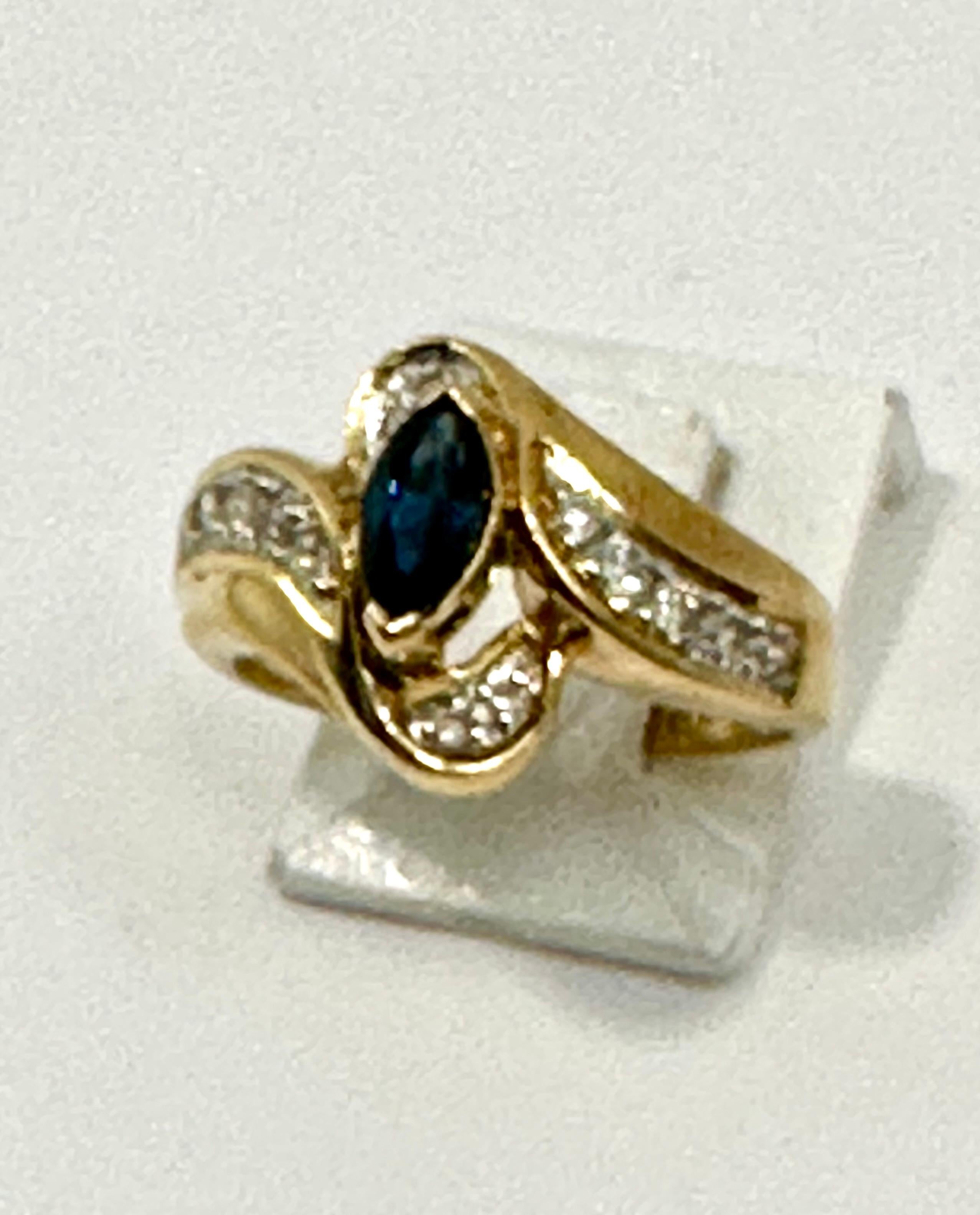 14k Yellow Gold 4mm x 6mm Marquise Sapphire and Diamond Ring ~ Size 7
with 14 diamonds

Meaning: Sapphire is a stone of wisdom and royalty, often associated with sacred things and considered the gem of gems, guiding individuals to an enlightened