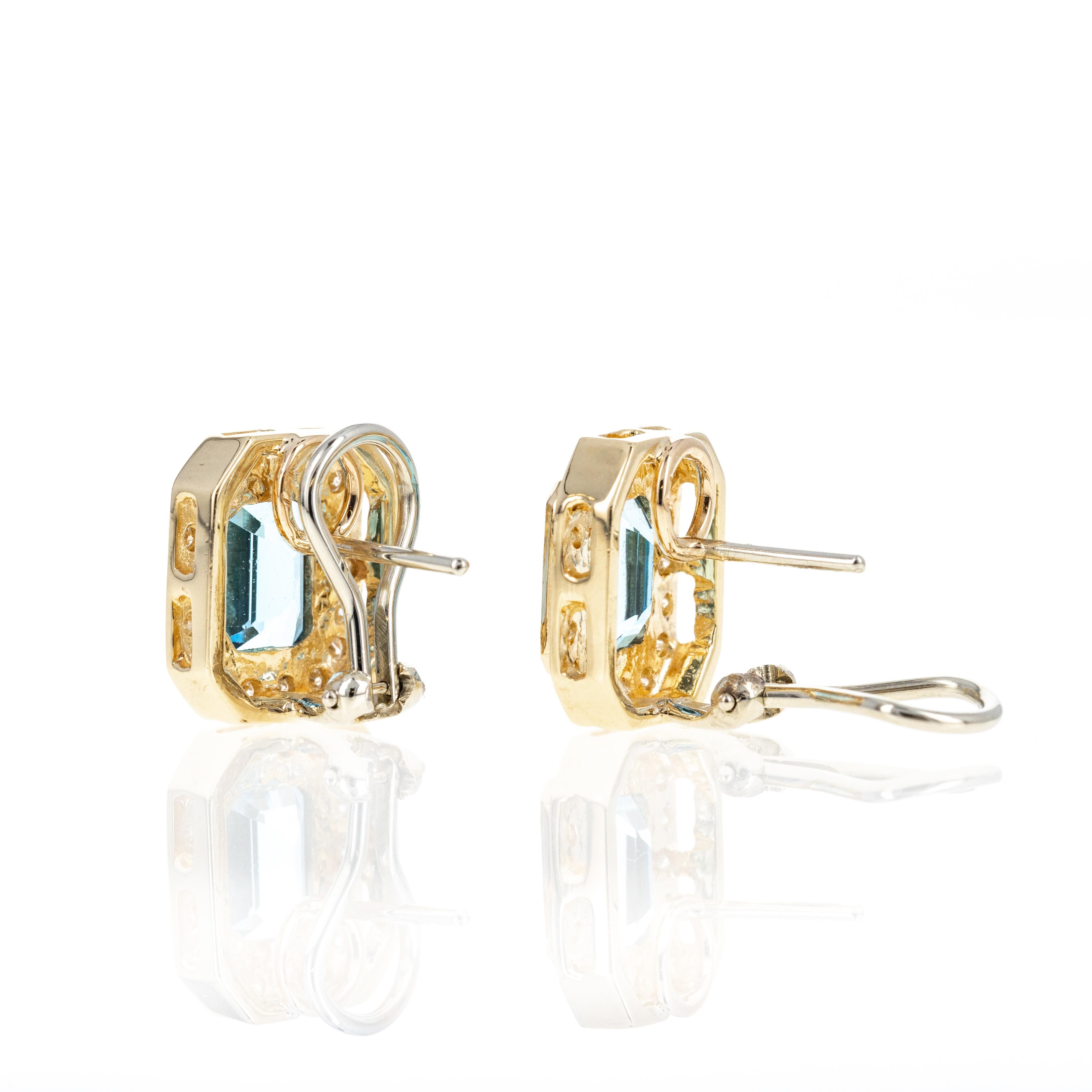 Era: Modern Estate
Composition: 14K Yellow Gold
Primary Stone: Two Emerald Cut Blue Topaz
Carat Weight: Approximately 5 Carats in Total
Accent Stone: Thirty-Six Round Brilliant Diamonds
Carat Weight: Approximately 0.35 Carats in Total
Color/Clarity:
