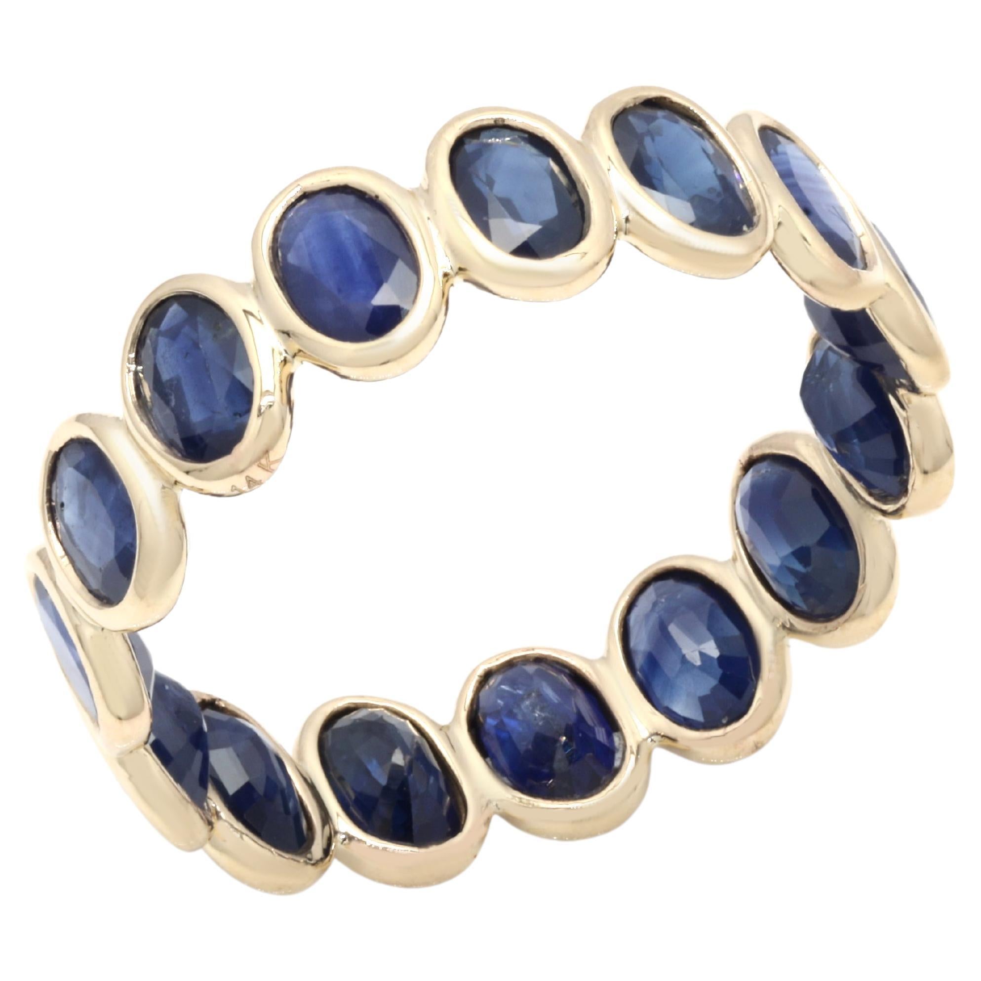 For Sale:  14K Yellow Gold 5 Carat Oval Cut Sapphire Eternity Band Ring