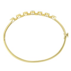 14K Yellow Gold 5MM Oval Shaped Tanzanite and 1/5 Carat Diamond Bangle Bracelet