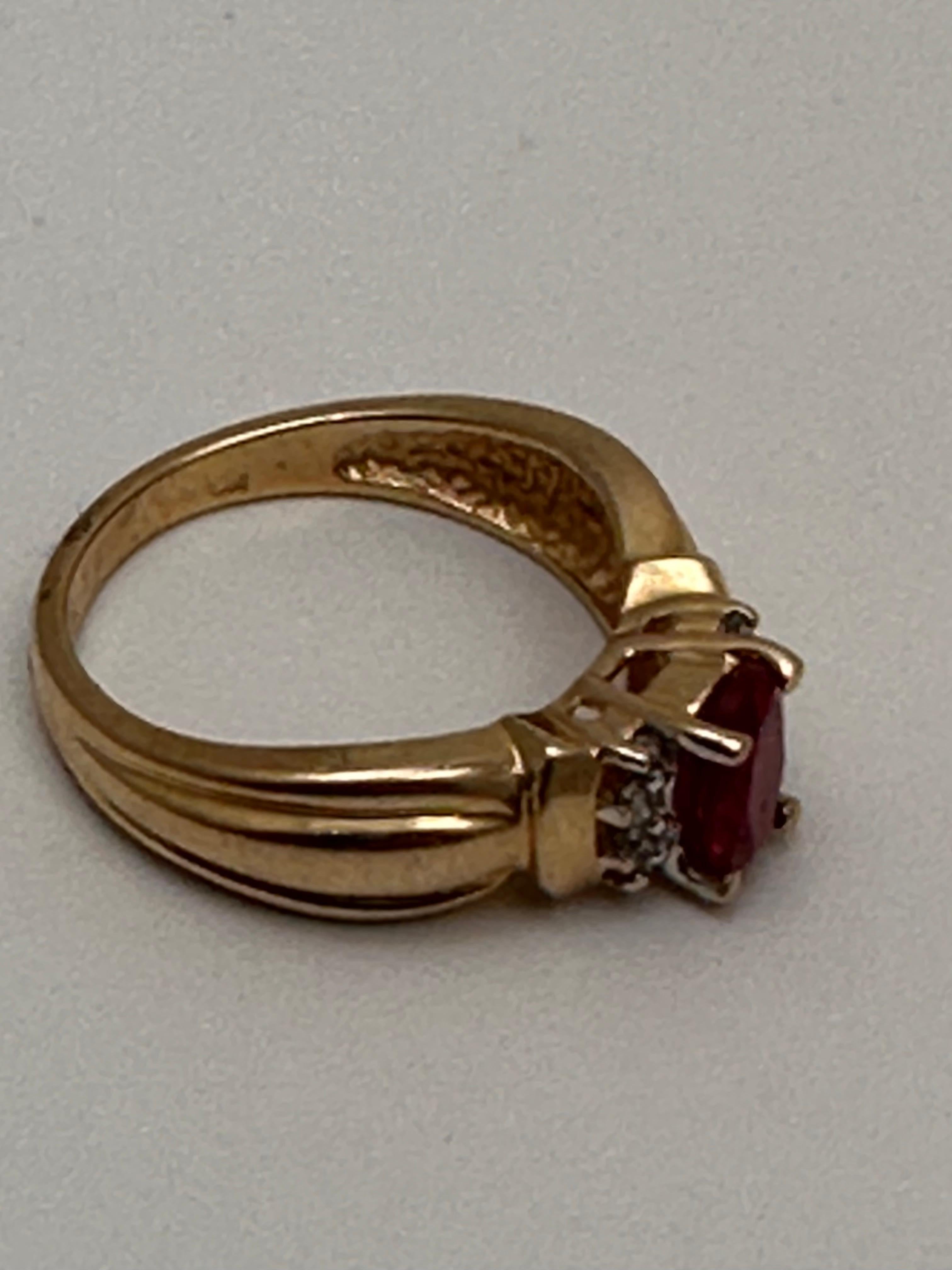 Women's 14k Yellow Gold ~ 5mm x 7mmm Oval Synthetic Ruby and Diamond Ring Size 6 1/4 For Sale