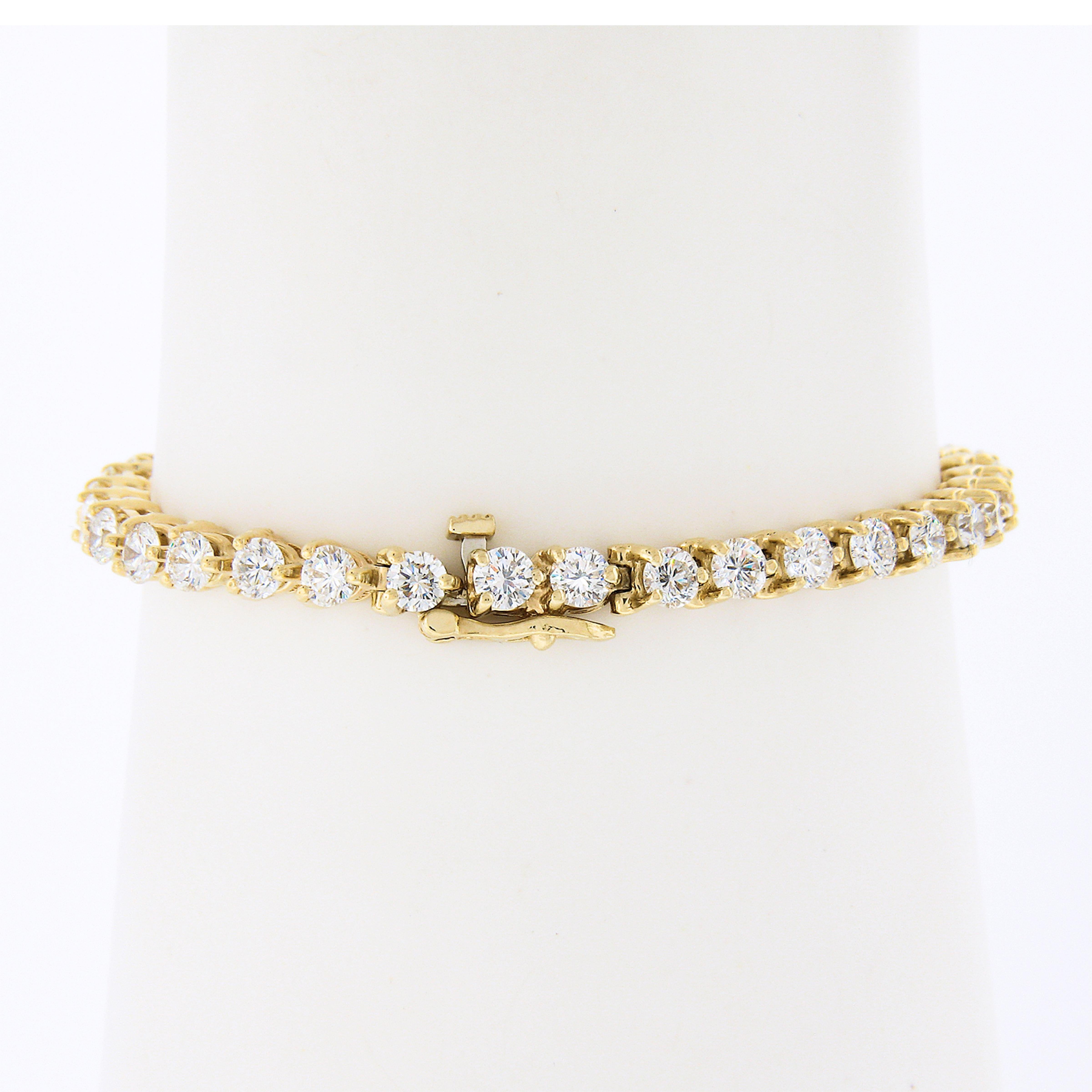 Here we have a truly breathtaking and classic diamond line tennis bracelet that is crafted in solid 14k yellow gold and set with 36 very fine quality round brilliant cut diamonds throughout. Each diamond individually sits in a fine and sturdy