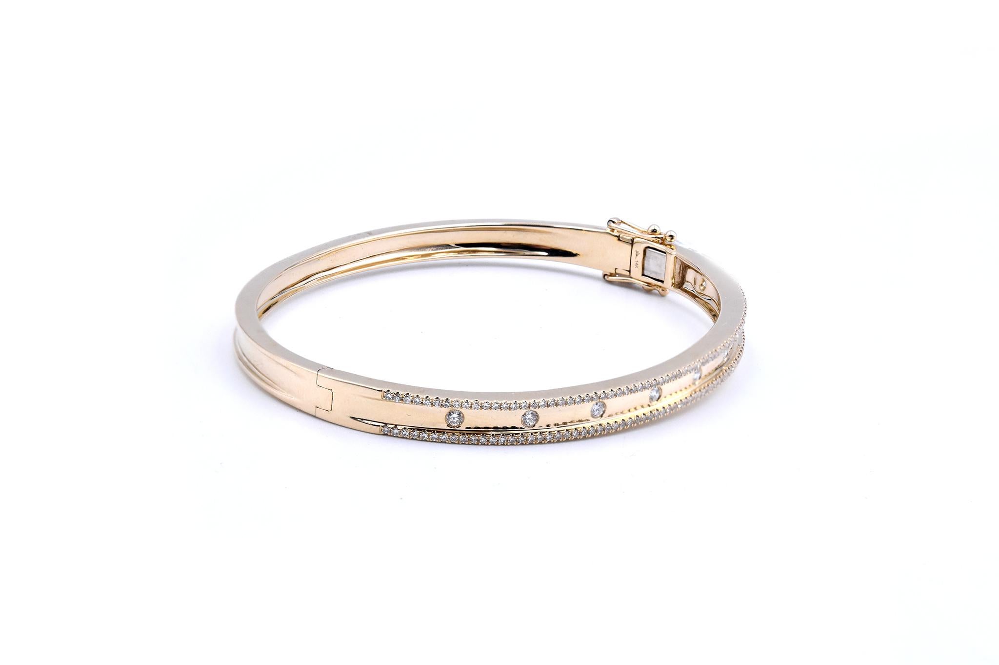 Material: 14k yellow gold
Diamonds: round brilliant cuts = 0.62cttw
Color: G
Clarity: VS
Dimensions: bangle will fit a 6 ½ -inch wrist
Weight: 15.87 grams