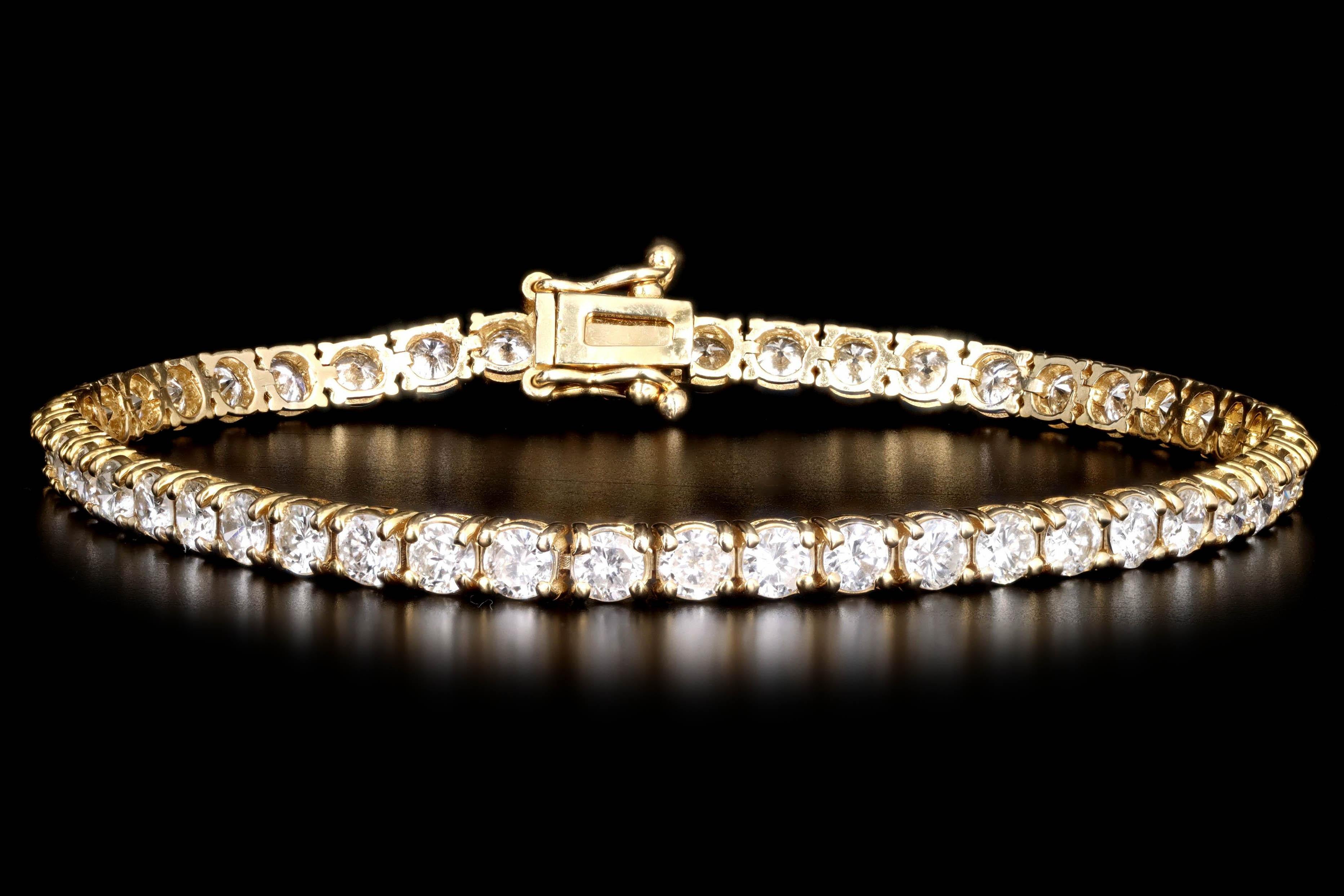 Era: New

Composition: 14K Yellow Gold

Primary Stone: Forty Two Round Brilliant Cut Diamonds

Total Carat Weight: Approximately 6.42 Carats

Color/Clarity: G/H - SI1/2

Bracelet Length: 7 Inches

Bracelet Weight: 8.5 Grams 

Item Barcode: 412325