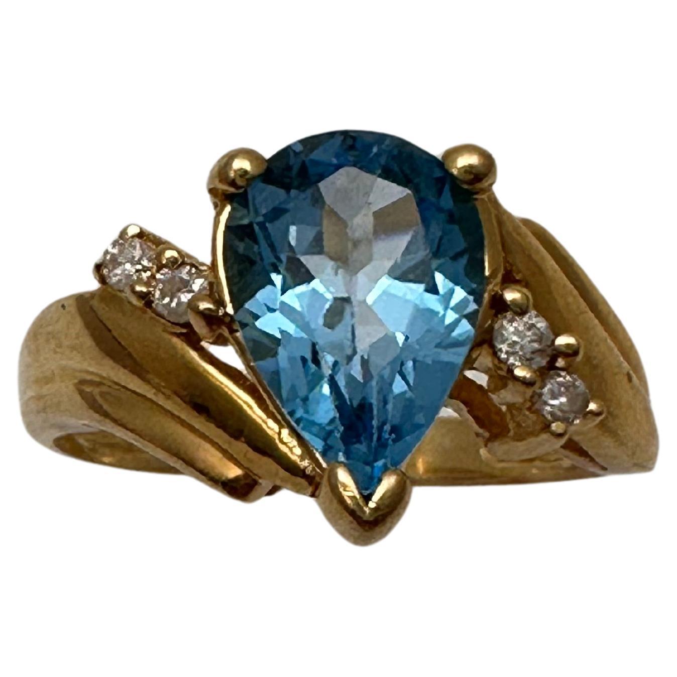 14k Yellow Gold 6.7mm x 10mm Pear Blue Topaz 4 Round Diamond Ring Size 6 1/2 For Sale