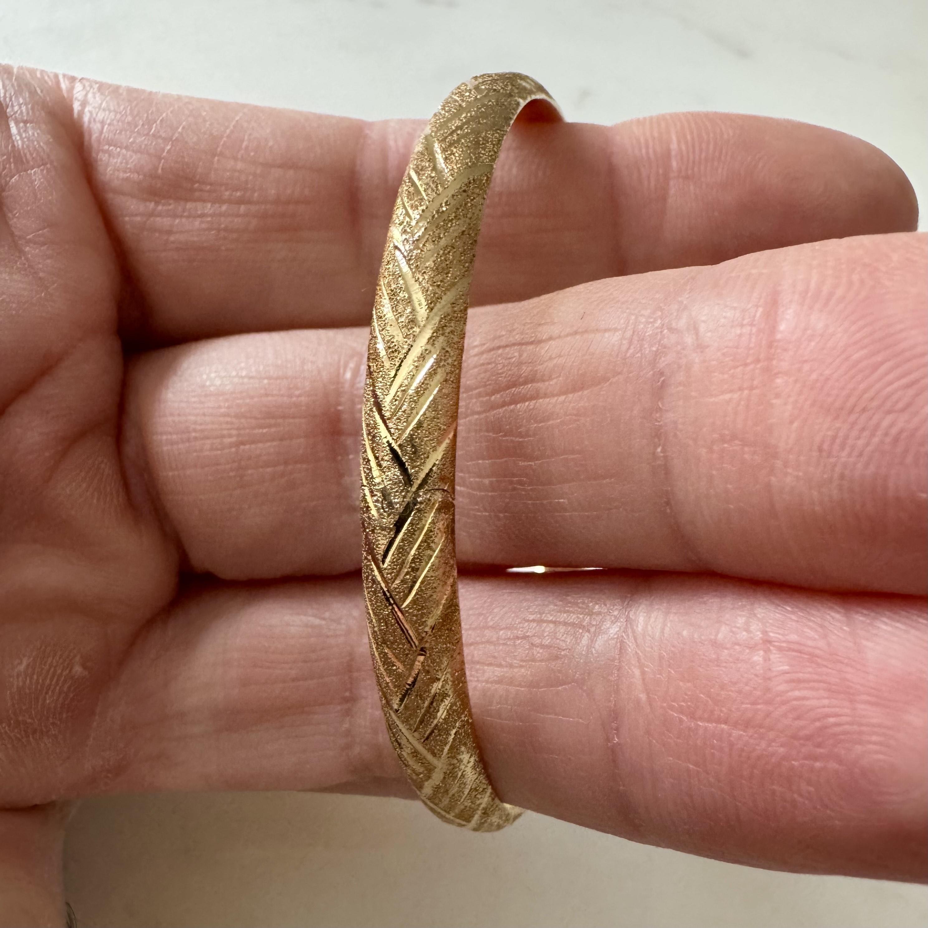 Condition:  Excellent Condition, Professionally Cleaned and Polished
Metal:  14k Gold (Marked, and Professionally Tested)
Weight:  6g
Length:  7.5 Inches Inner Circumference
Width:  6.5mm
Closure:  Slide Bar Insert
Markings:  