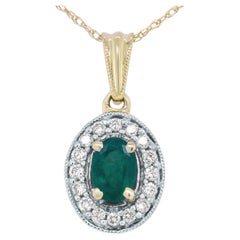 14K Yellow Gold Emerald and 1/5 Carat Round Diamond Halo Pendant Necklace
