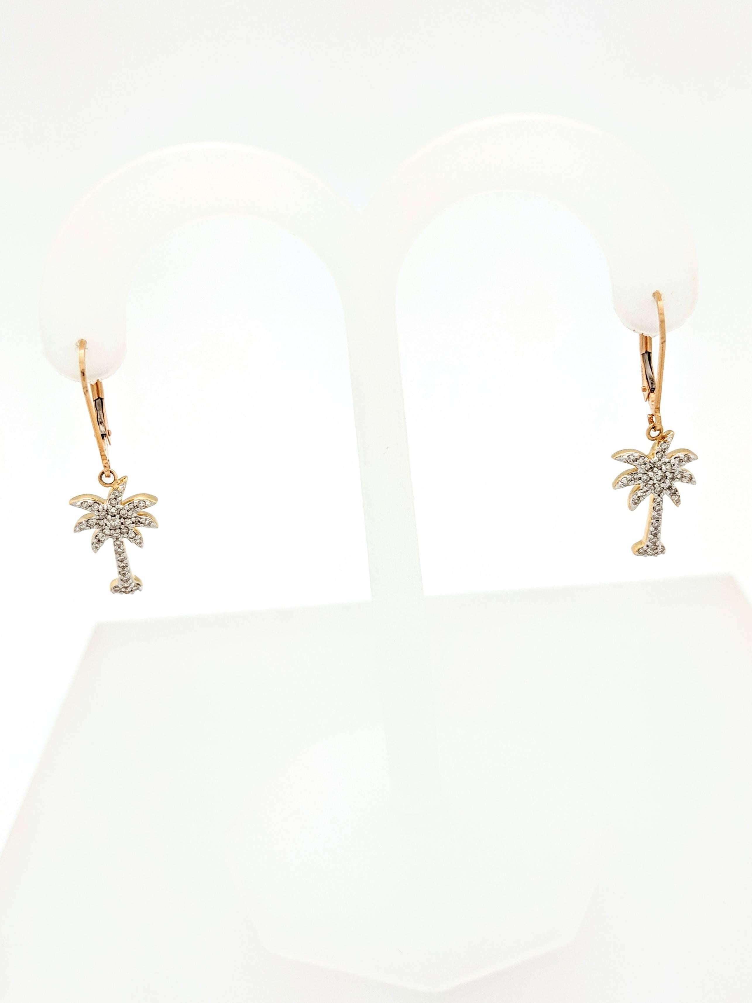 Ladies 14K Yellow Gold .70ctw Diamond Palm Tree Dangle Earrings SI2/H

You are viewing a pair of gorgeous diamond palm tree dangle/drop earrings. These earrings are crafted from 14k yellow gold, weigh 2.5 grams and measure 1 1/4