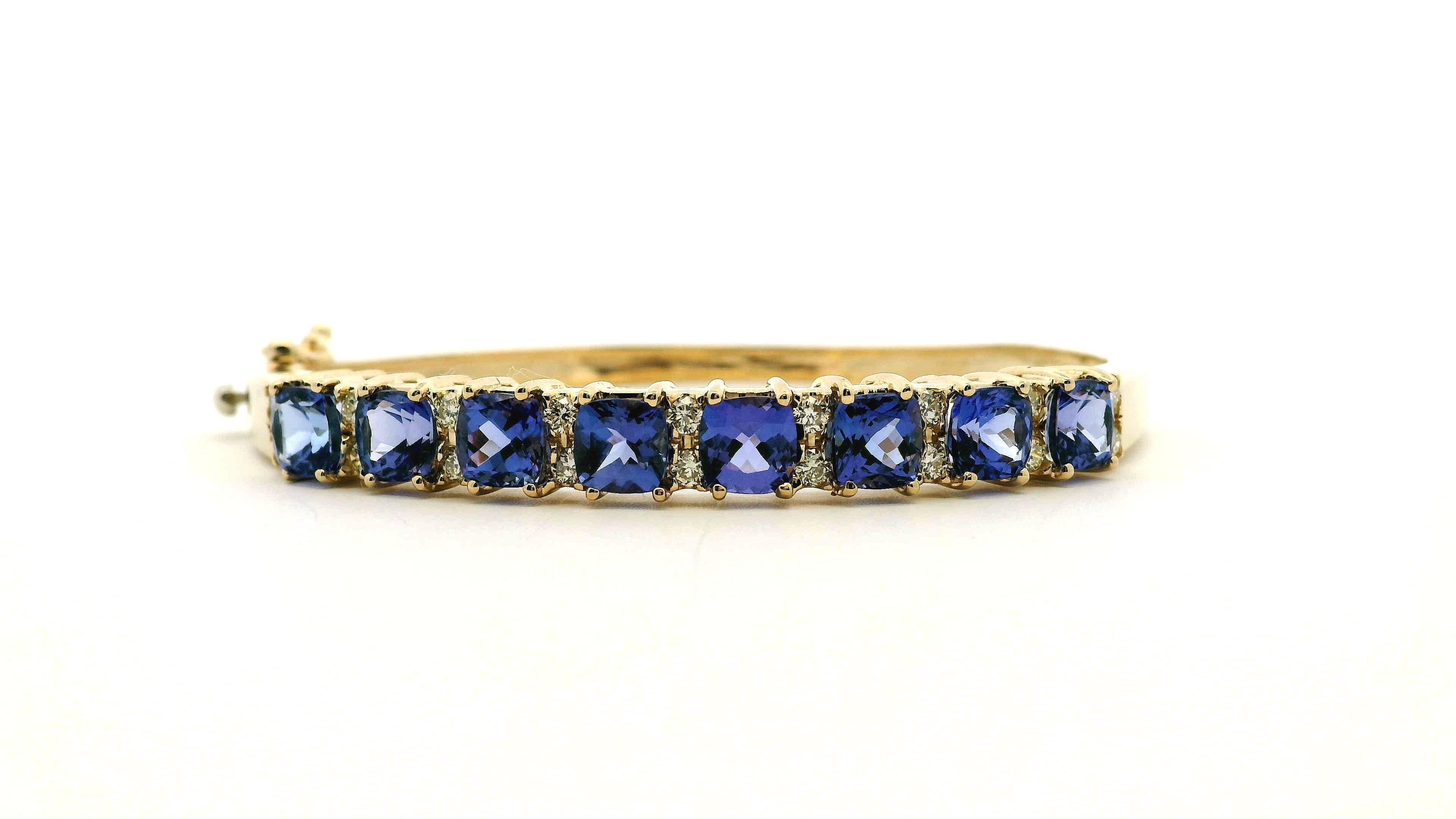 14k Yellow Gold 7.10ctw Tanzanite and 0.65ctw Round Diamond Bangle

This vibrant Tanzanite and Diamond Bangle is in excellent condition and ready to ship!

Type: Bangle Bracelet
Material: 14k Yellow Gold
Gemstone Details: Features approximately 7.10