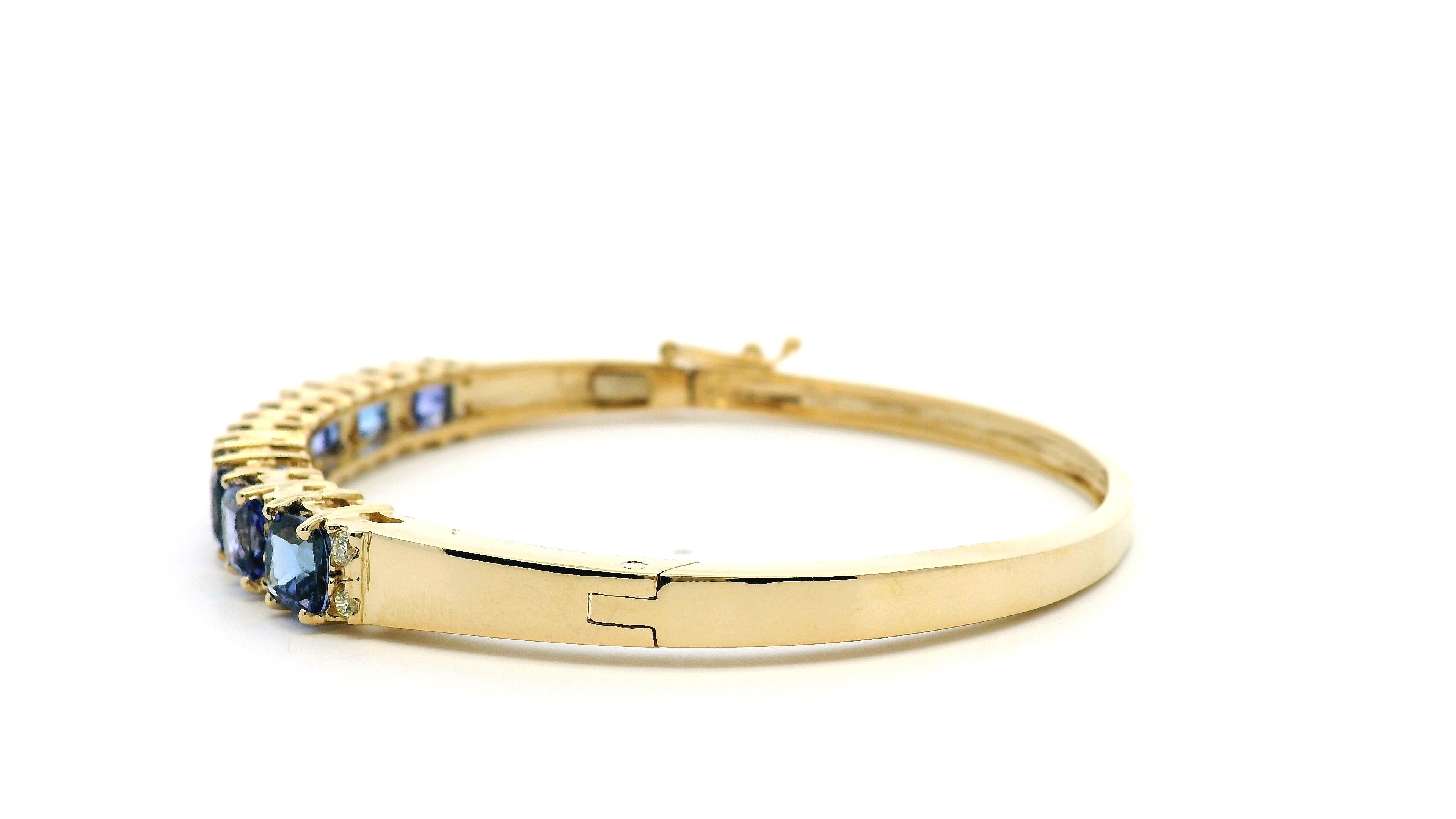 Women's 14k Yellow Gold 7.10ctw Tanzanite and 0.65ctw Round Diamond Bangle For Sale