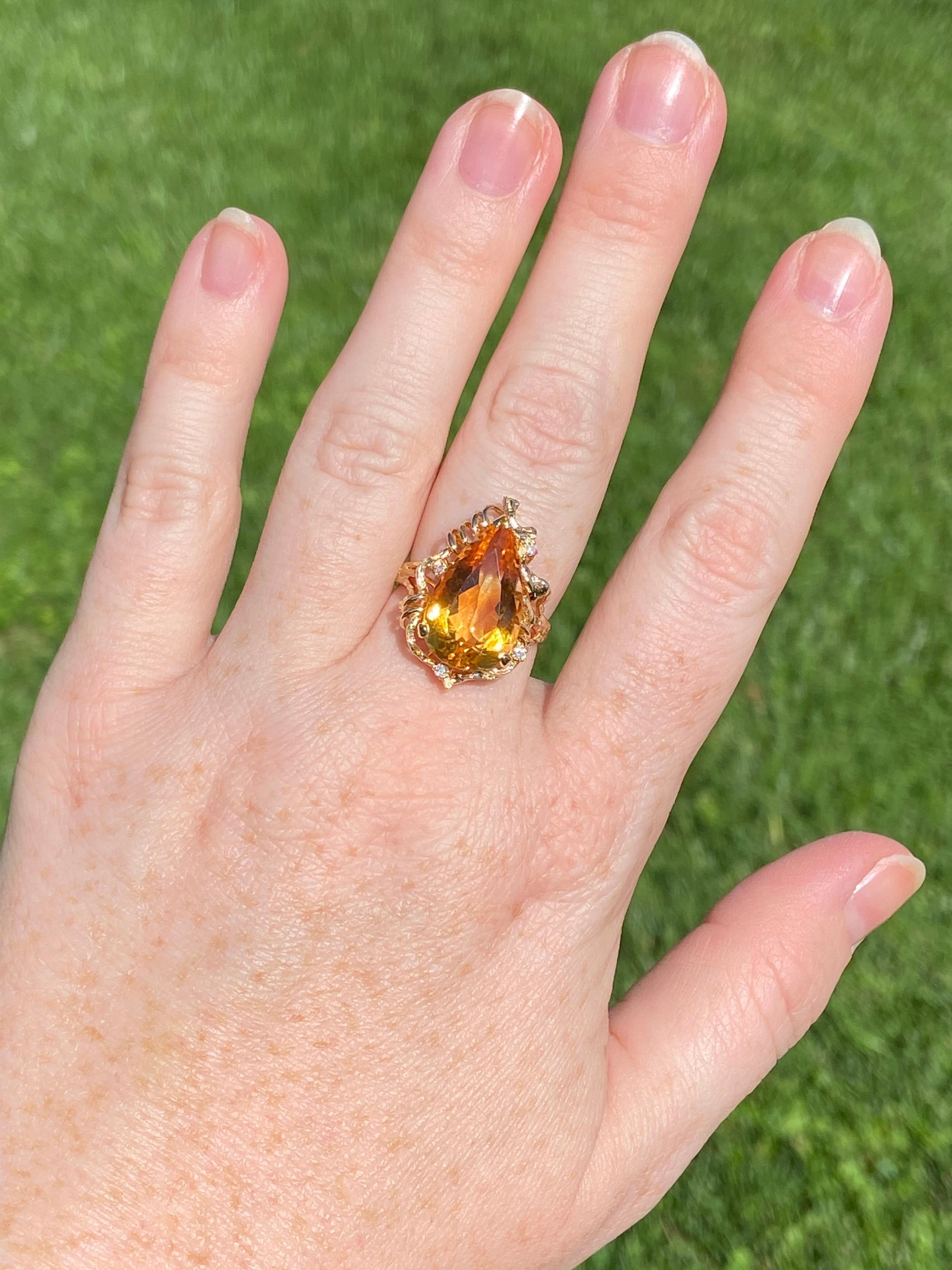 Like a perfect teardrop of sunshine for the finger, this citrine has the perfect yellow-orange golden hue. As your move your hand, you'll see intensely saturated flashes of both golden yellow and orange. The asymmetrical organic setting, typical of