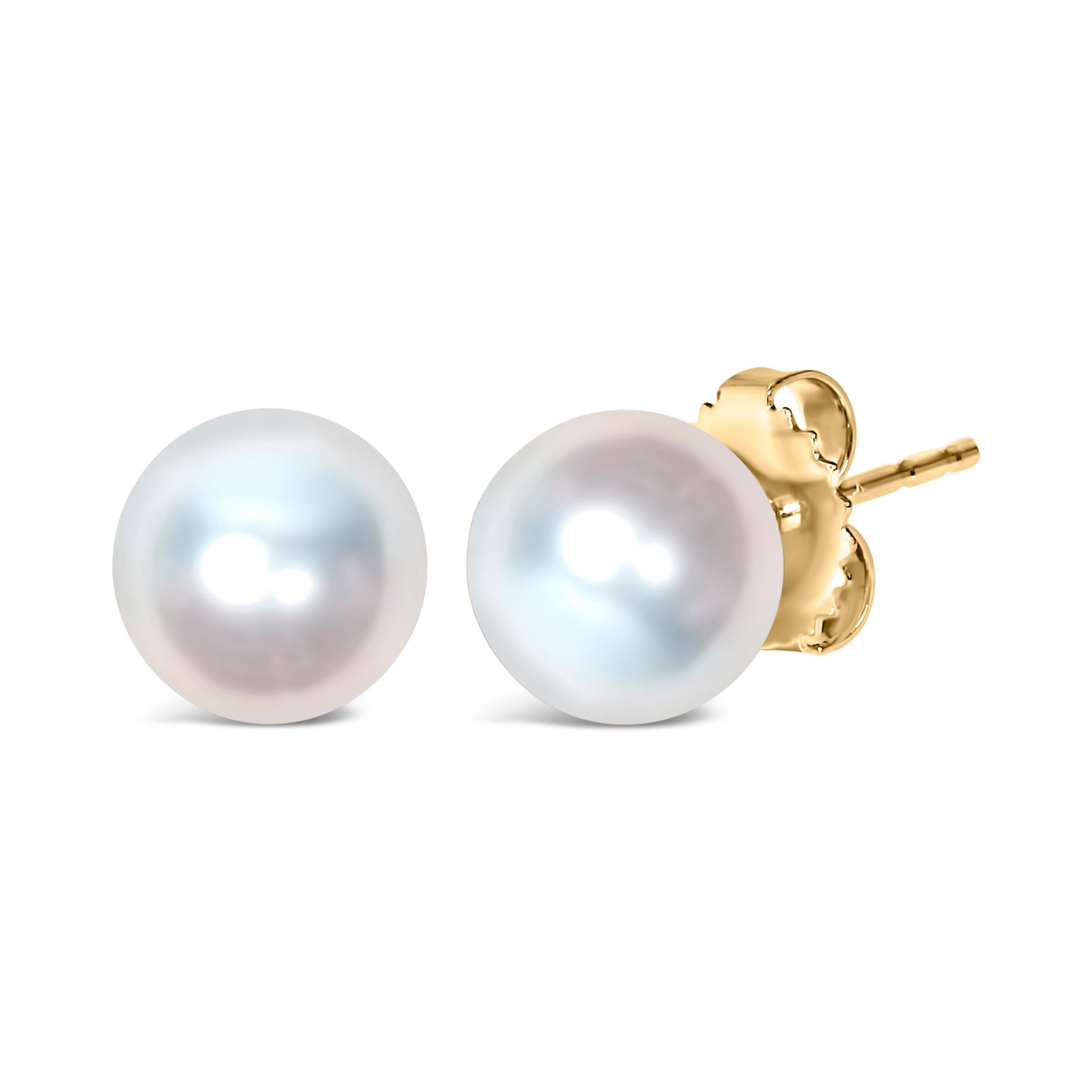 Discover the understated elegance of these exquisite cultured freshwater pearl stud earrings, a testament to classic style and timeless craftsmanship. Each pearl, nestled in a polished cup of 14k yellow gold, measures a generous 8.0-8.5mm and glows