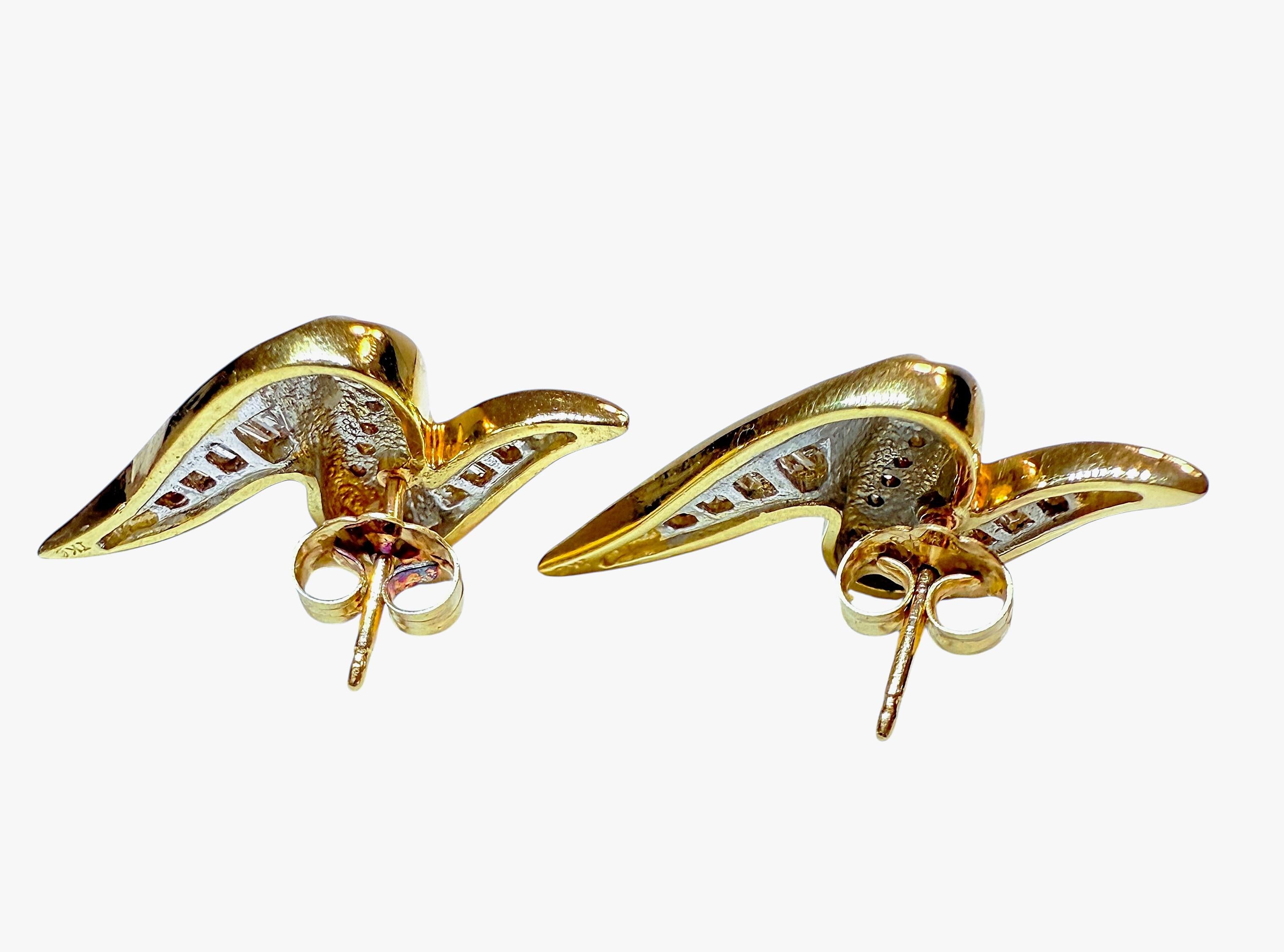 These earrings are just beautiful!  They are 14k yellow gold post earrings.  There are 5 baguette Diamonds on the top separated by 5 brilliant cut diamonds and then another 7 baguette diamonds on the bottom of the earrings.  All told, there is .32
