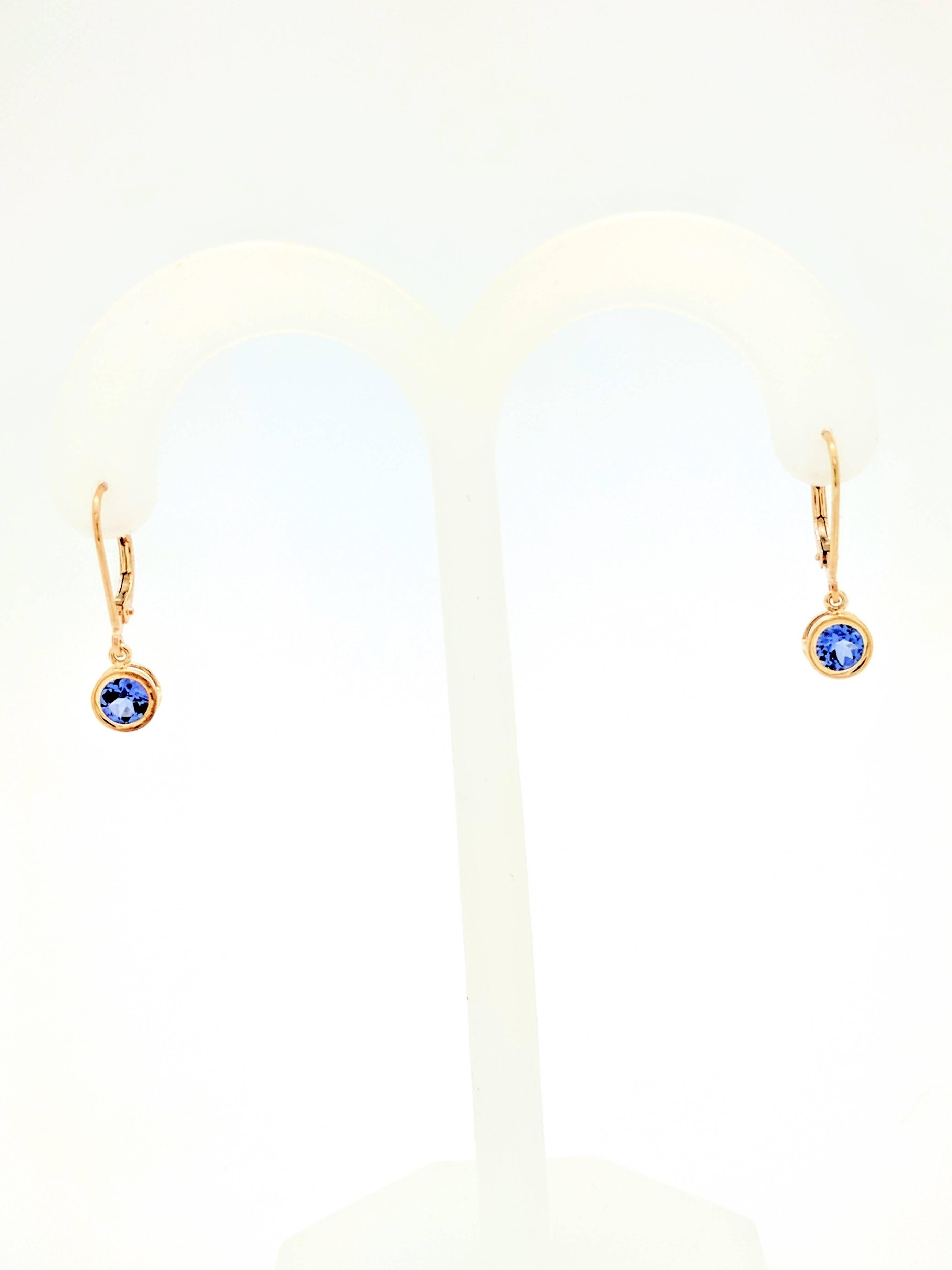 14K Yellow Gold .80ctw Round Bezel Set Tanzanite Dangle Earrings

You are viewing a beautiful pair of bezel set tanzanite dangle earrings. These earrings are crafted from 14k yellow gold and weighs 1.3 grams. Each earring features (1) .40ct round