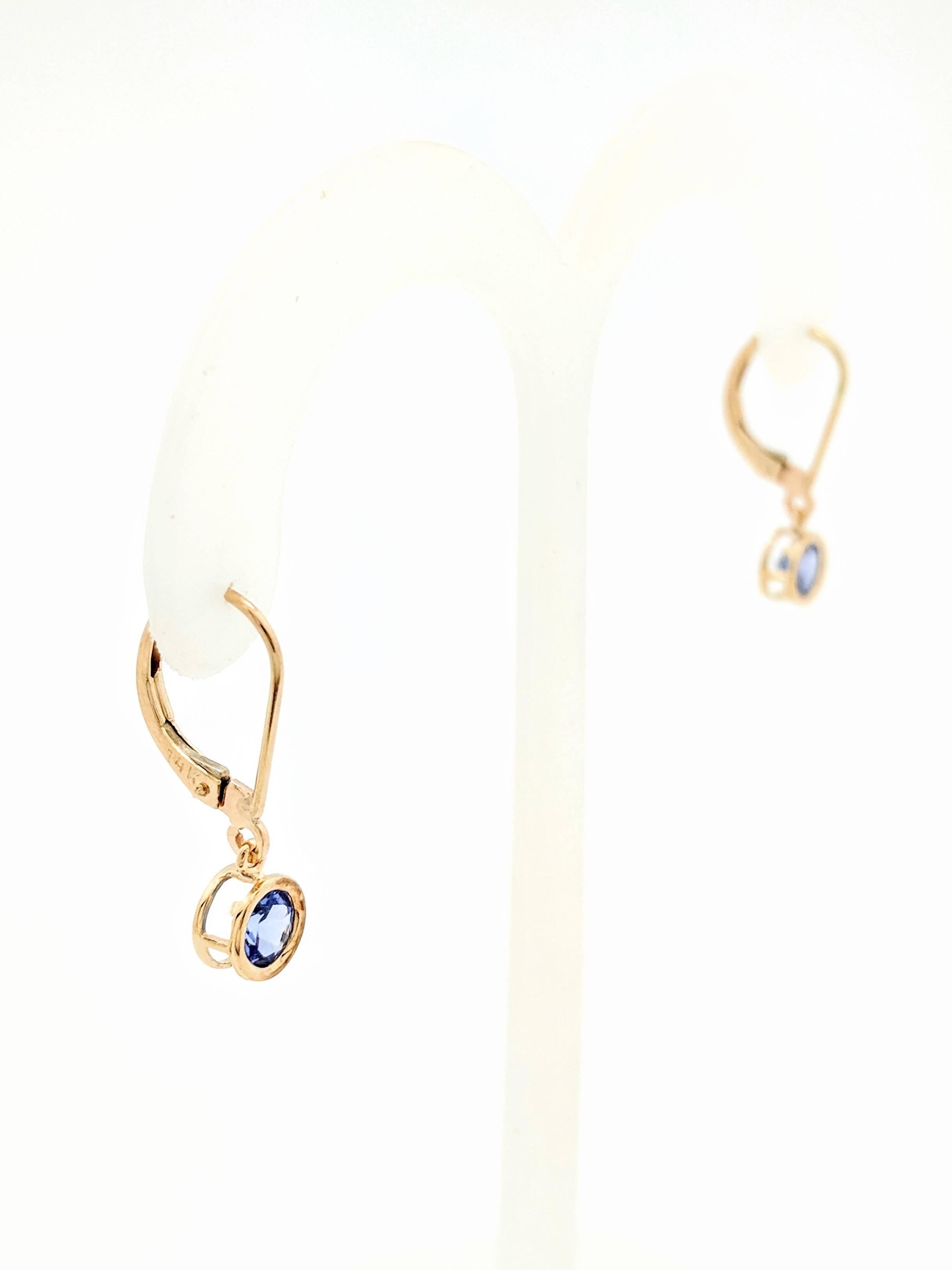 Contemporary 14 Karat Yellow Gold .80 Carat Round Bezel Set Tanzanite Dangle Earrings For Sale