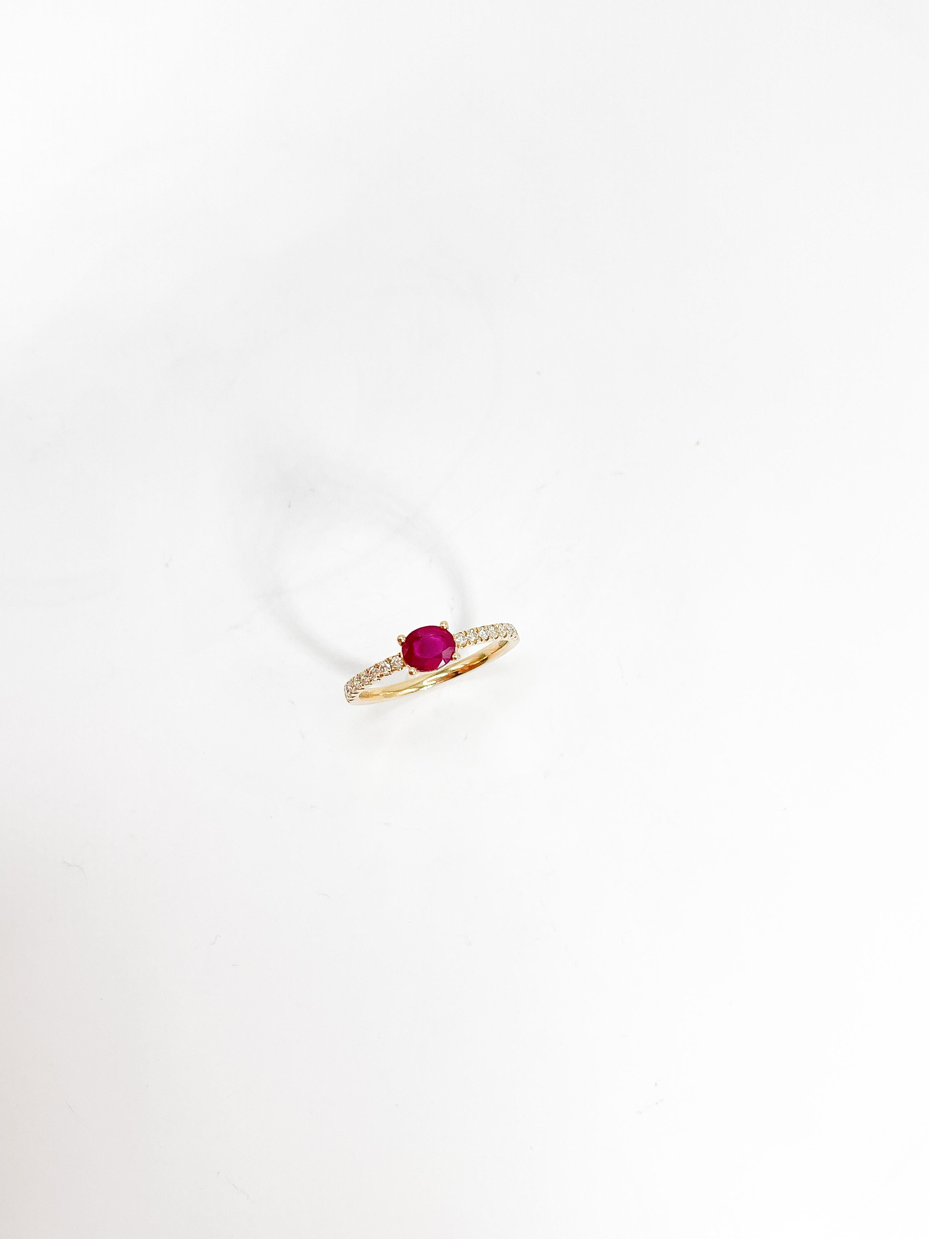 14k yellow gold .82 ruby and .19 diamond Ring. This ring has an oval ruby going east to west with diamond side stones that go halfway. Ring is a size 7, the width of the ring is 4.7 mm and has a weight of 1.77 grams.