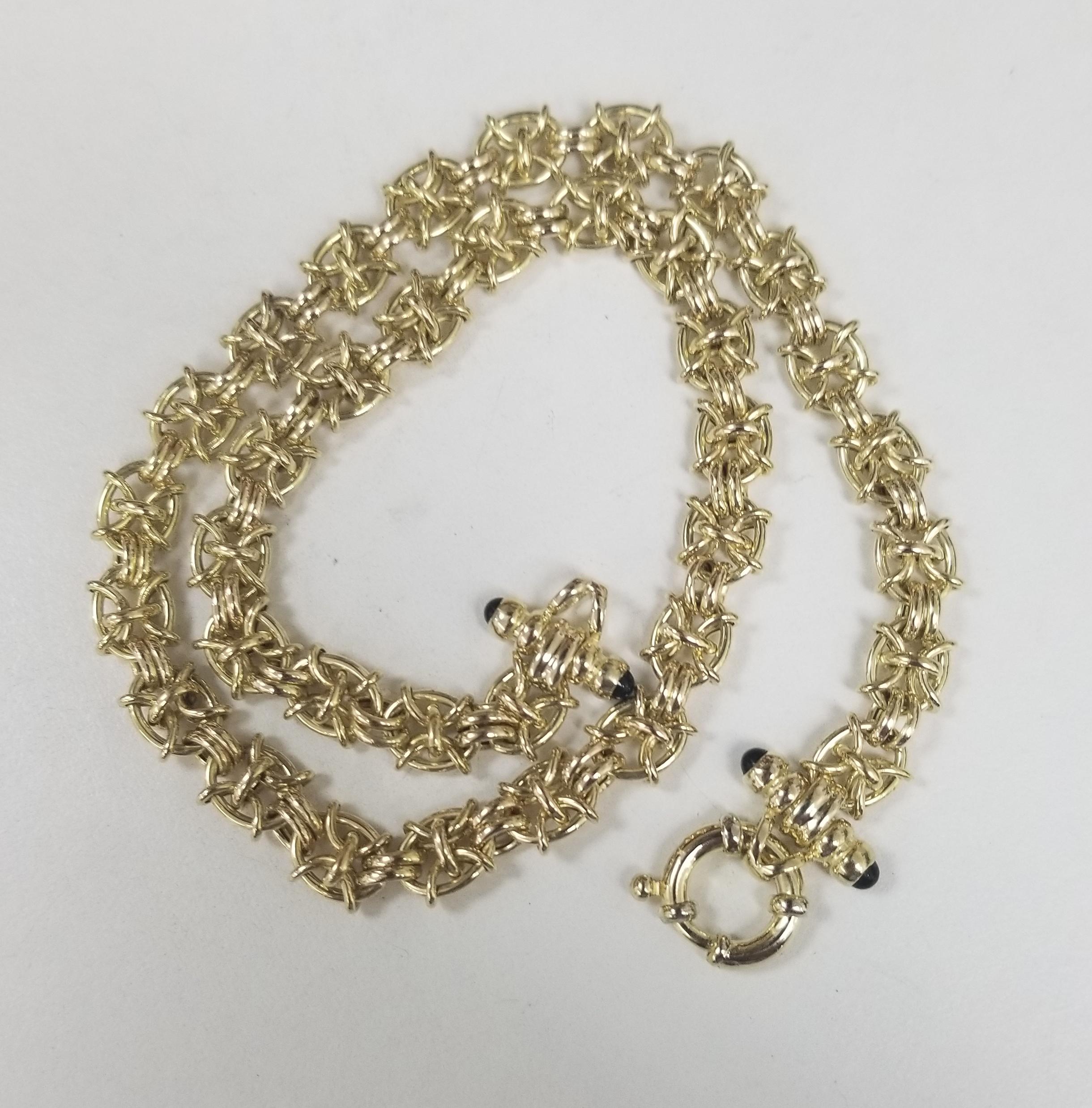 14k yellow gold hollow fancy anchor necklace with sapphire 4 cabochons at the ends of the clasp.  the necklace is 8.5mm wide and 17.5 inch long with a large clasp. the necklace weighs 23.20 grams.