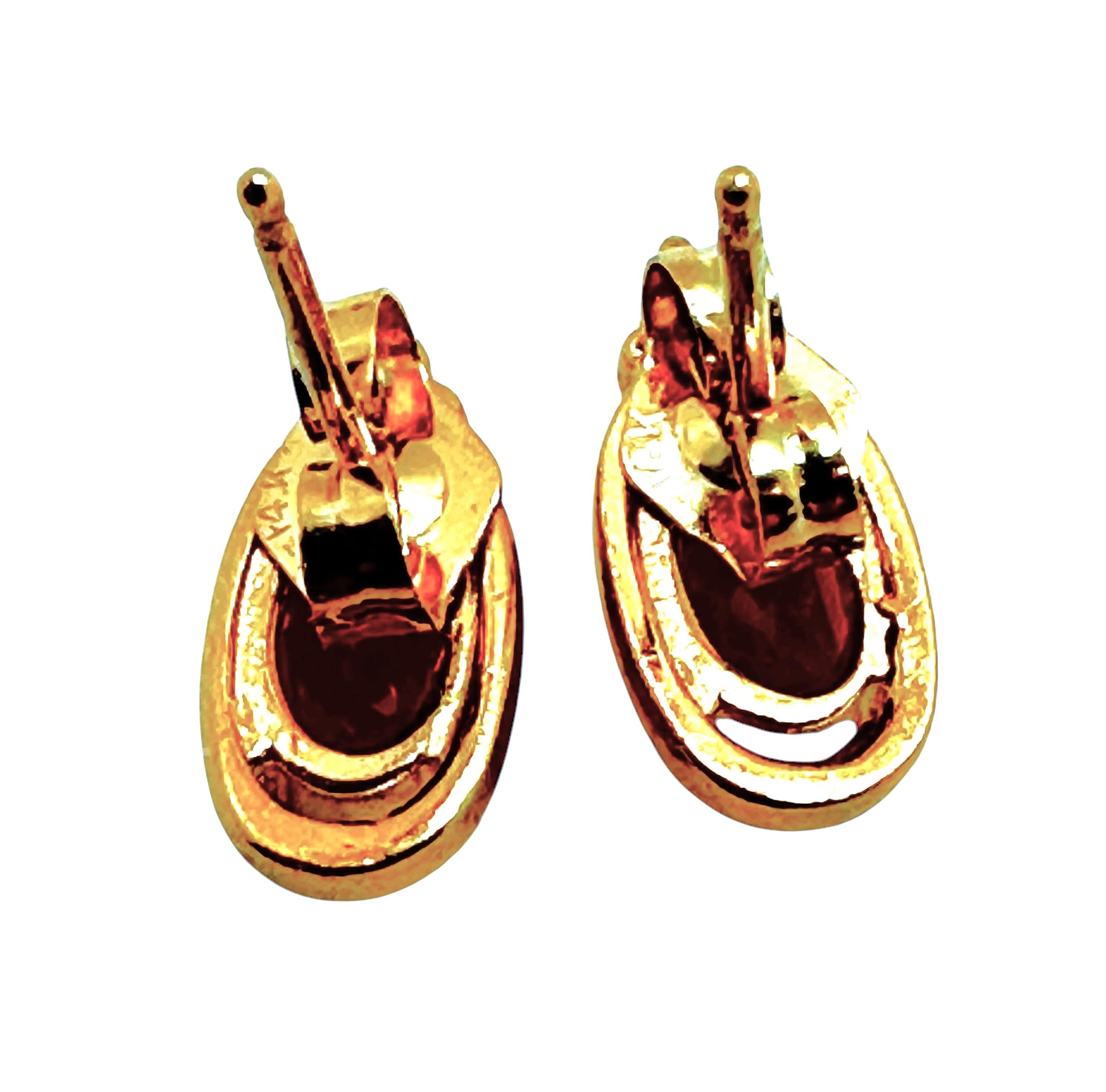 These are beautiful classic earrings with oval cut Citrine stones and brilliant cut diamonds.  The Citrine stone measure 6 x 4 mm and total .43 carats each.  The earrings are 10 mm long and 6 mm wide.  They each have a 2 mm brilliant cut diamond on